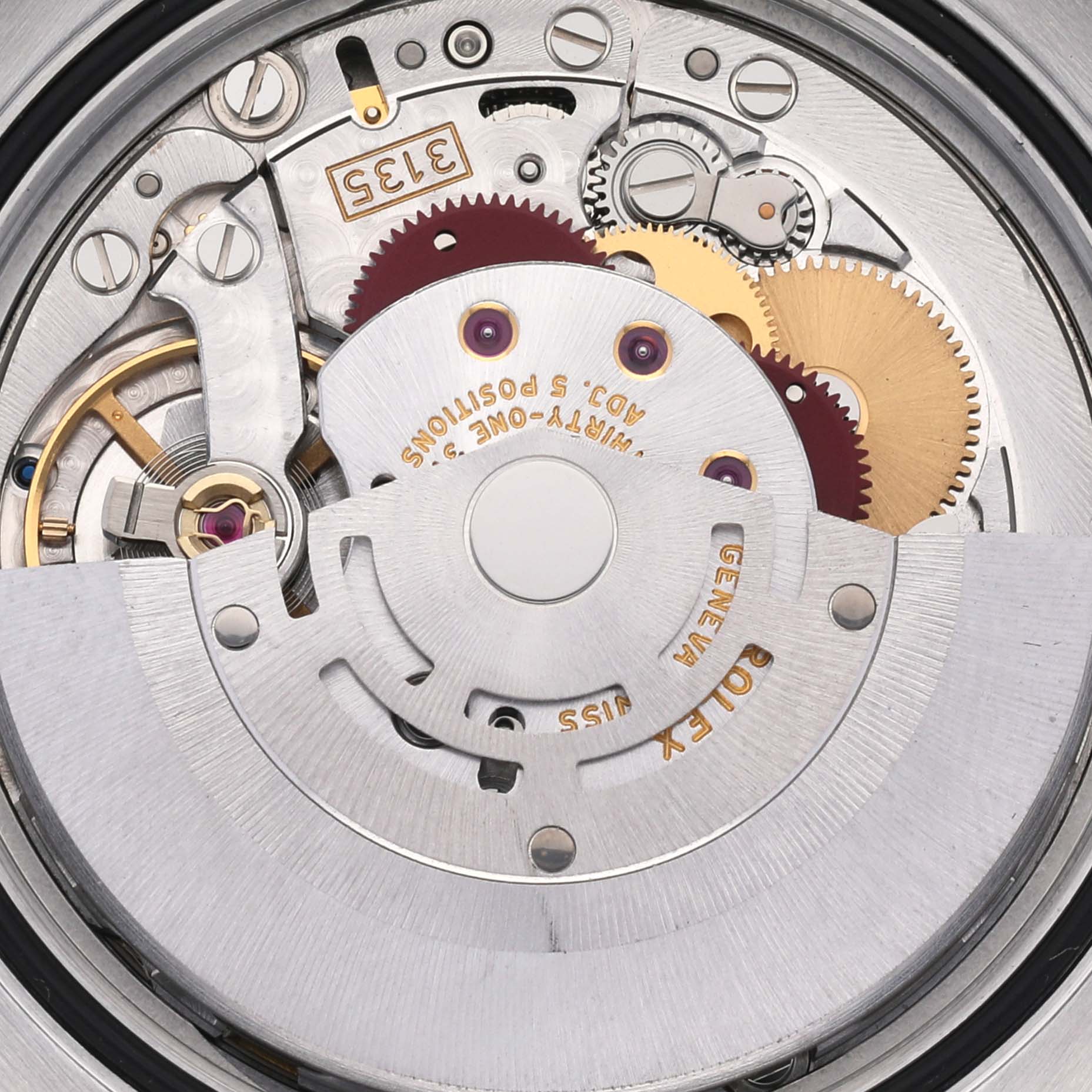 This close-up view of a Rolex Datejust 116243 Men's Steel and Gold (two tone) White Dial 116243 Men's Steel and Gold (two tone) White Dial model displays its intricate mechanical movement and internal components.