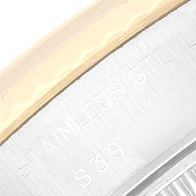 The image shows a close-up of the bezel and outer case back of a Rolex Datejust 69173 Women's Steel and Gold (two tone) Beige Dial 69173 Women's Steel and Gold (two tone) Beige Dial model watch, highlighting the gold and stainless steel materials.