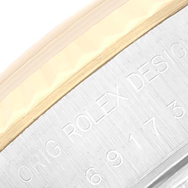 This close-up image shows a portion of the bezel and the side of a Rolex Datejust 69173 Women's Steel and Gold (two tone) Beige Dial 69173 Women's Steel and Gold (two tone) Beige Dial watch, highlighting the "Orig Rolex Design" engraving.