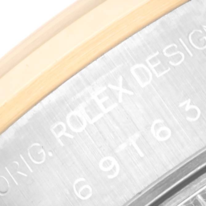 This image shows a close-up of the case back engraving of a Rolex Datejust 69163 Women's Steel and Gold (two tone) Grey Dial 69163 Women's Steel and Gold (two tone) Grey Dial watch, highlighting the "ROLEX DESIGN" inscription.