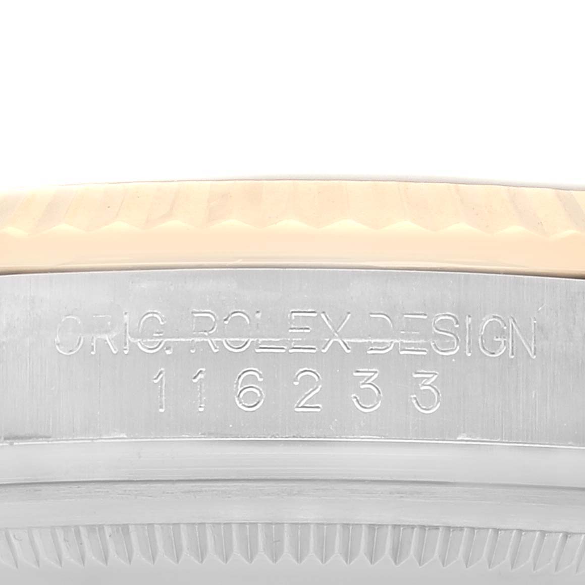 The image shows a close-up of the case side of a Rolex Datejust 116233 Men's Steel and Gold (two tone) White Dial 116233 Men's Steel and Gold (two tone) White Dial, featuring the engraved model number and part of the bezel.