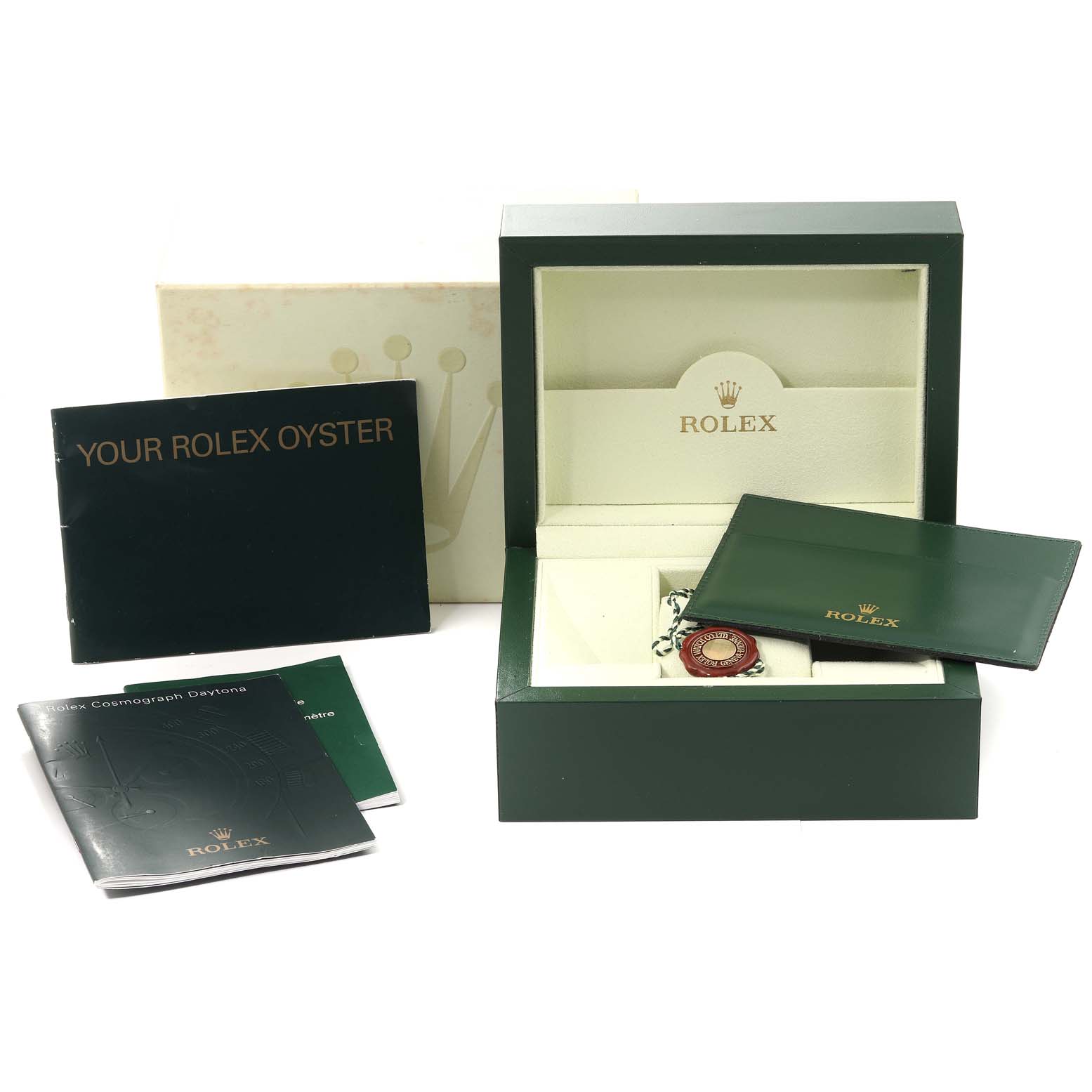 The image shows a Rolex Daytona 116520 Men's Stainless Steel Black Dial 116520 Men's Stainless Steel Black Dial watch box and accessories at a straight-on angle, including manuals and a warranty card.