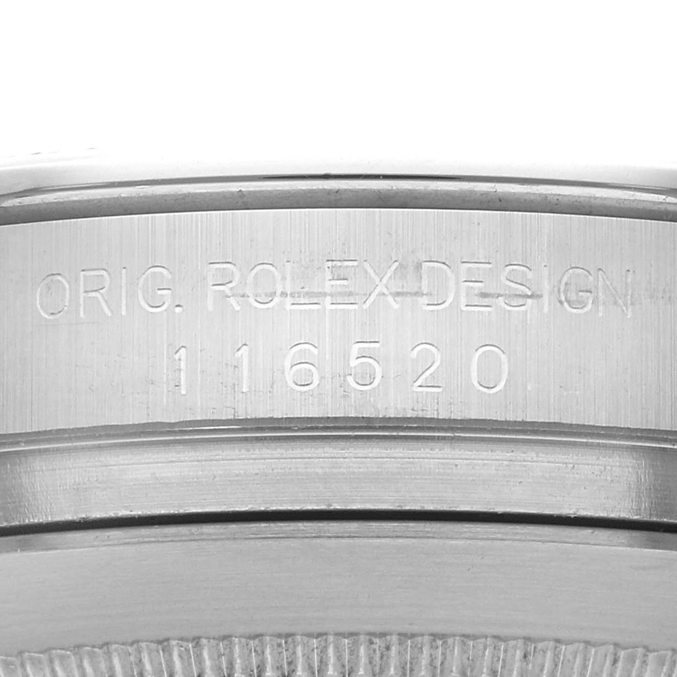 This image shows a close-up of the case side engraving on a Rolex Daytona 116520 Men's Stainless Steel Black Dial 116520 Men's Stainless Steel Black Dial model watch.