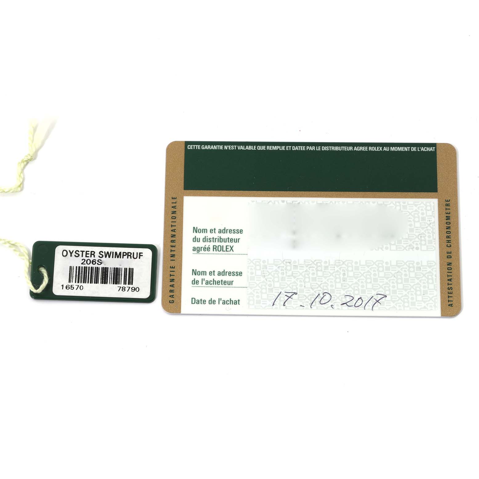 The image shows a warranty card and tag for a Rolex Explorer 16570T Men's Stainless Steel Black Dial 16570T Men's Stainless Steel Black Dial model watch.