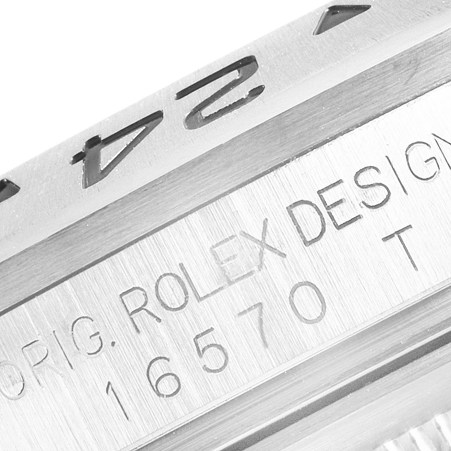 The image shows a close-up side view of the bezel and engraved serial number on a Rolex Explorer 16570T Men's Stainless Steel Black Dial 16570T Men's Stainless Steel Black Dial watch.