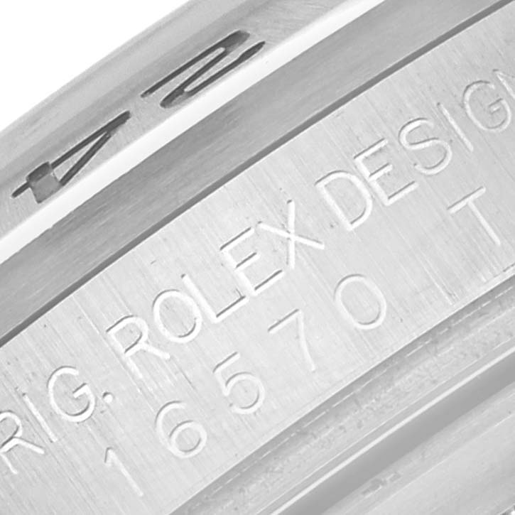The image shows a close-up of the inner bezel and engraving details of the Rolex Explorer 16570T Men's Stainless Steel Black Dial 16570T Men's Stainless Steel Black Dial watch.