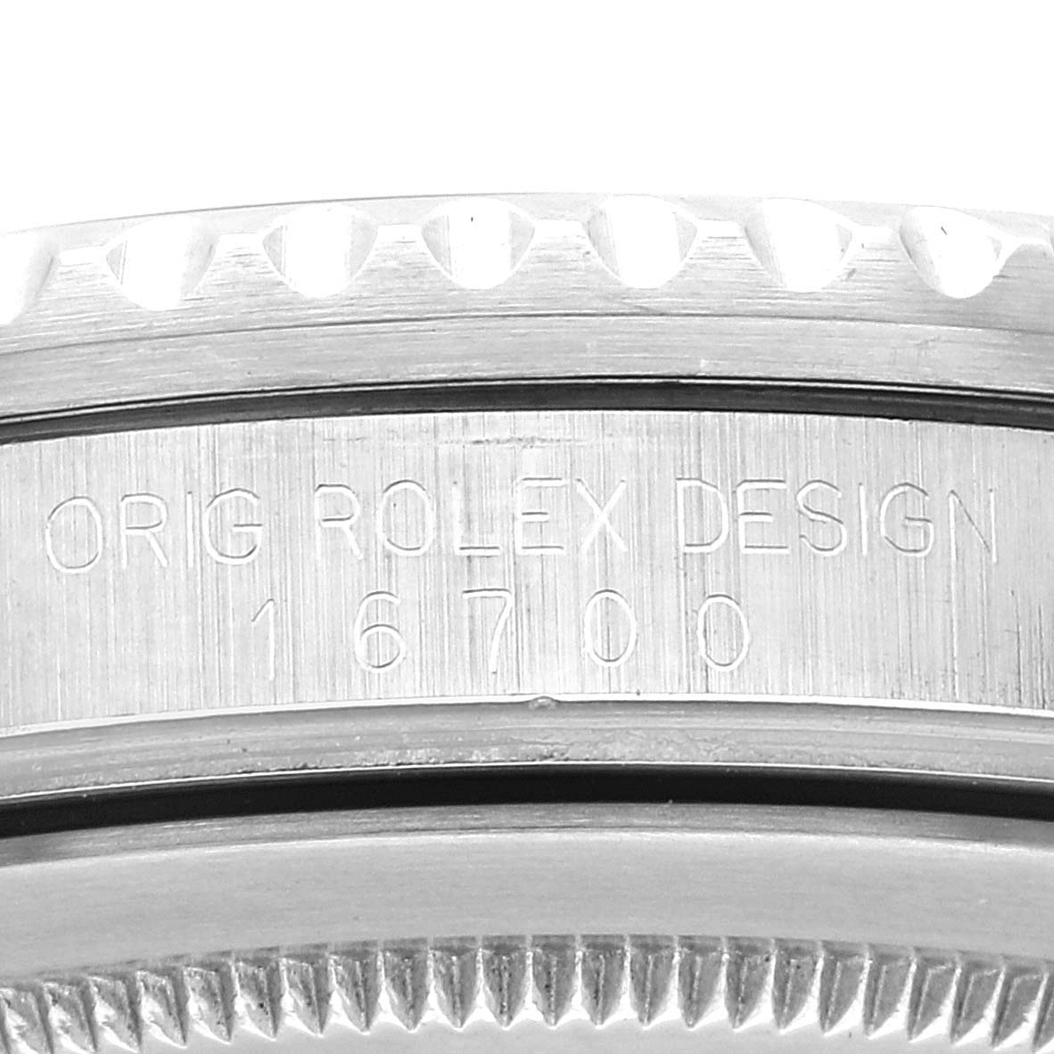 The image shows an engraved case side of a Rolex GMT-Master 16700 Men
s Stainless Steel Black Dial 16700 Men
s Stainless Steel Black Dial model, detailing the design number "16700".