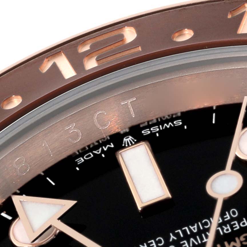 This close-up shows the bezel, part of the face, and hour markers of the Rolex GMT-Master 126715CHNR Men
s Rose Gold Black Dial 126715CHNR Men
s Rose Gold Black Dial watch.