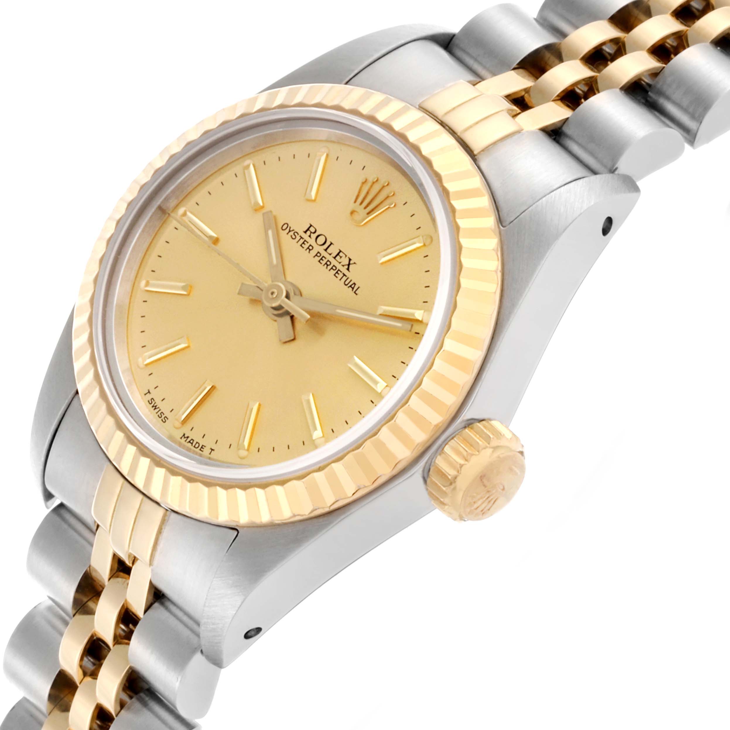 The Rolex Oyster Perpetual 67193 Women's Steel and Gold (two tone) Champagne Dial 67193 Women's Steel and Gold (two tone) Champagne Dial watch is shown in a tilted side view, highlighting the bezel, crown, and part of the bracelet.