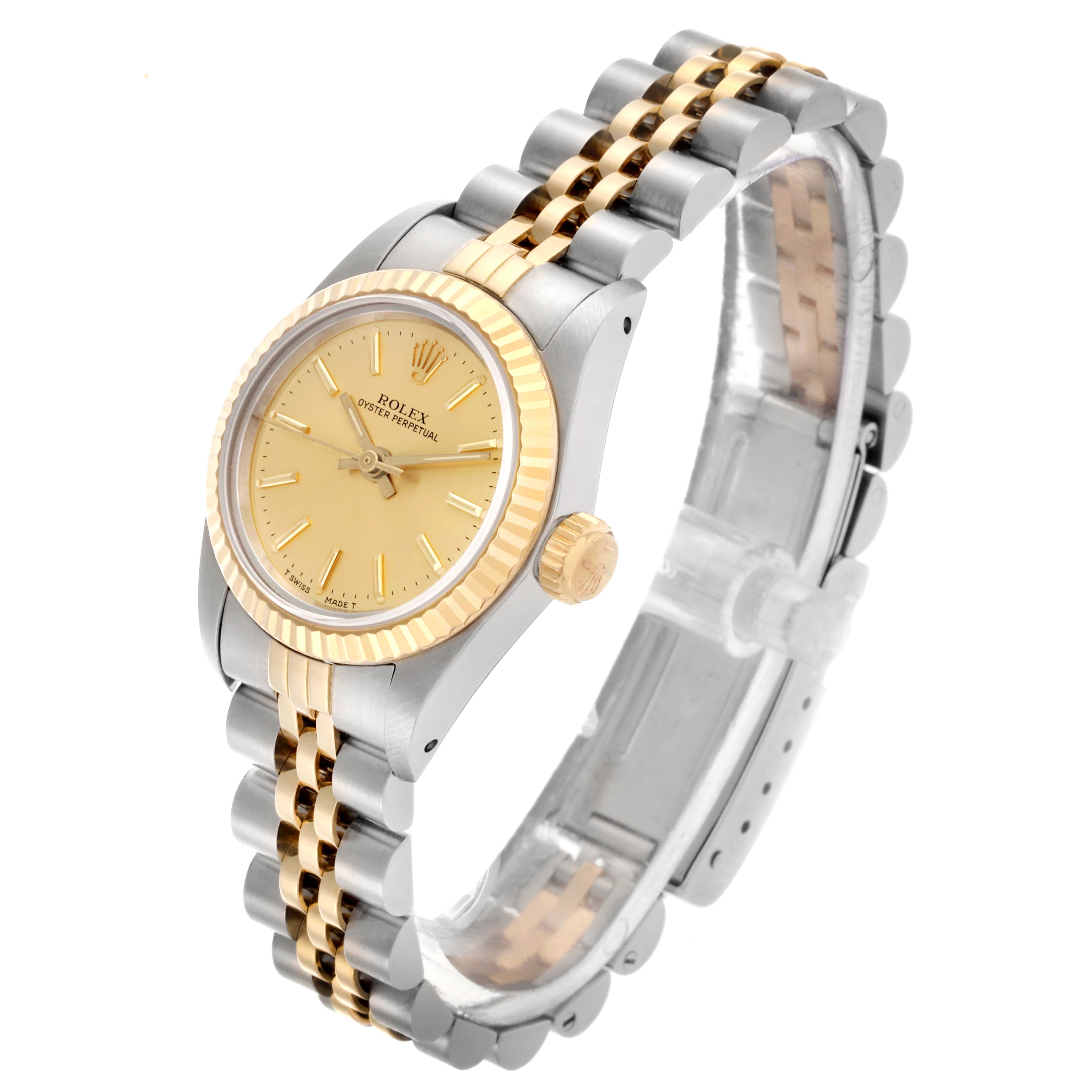 The Rolex Oyster Perpetual 67193 Women's Steel and Gold (two tone) Champagne Dial 67193 Women's Steel and Gold (two tone) Champagne Dial watch is shown at a three-quarter angle, highlighting its face, bezel, crown, and two-tone bracelet.