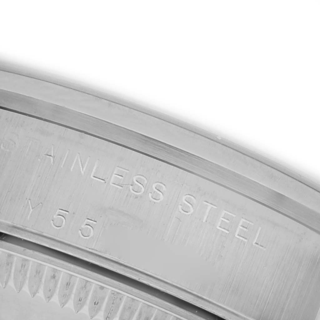 The image shows a close-up of the case back of a Rolex Mid-Size 77080 Women's Stainless Steel Silver Dial 77080 Women's Stainless Steel Silver Dial watch with the "Stainless Steel" marking.