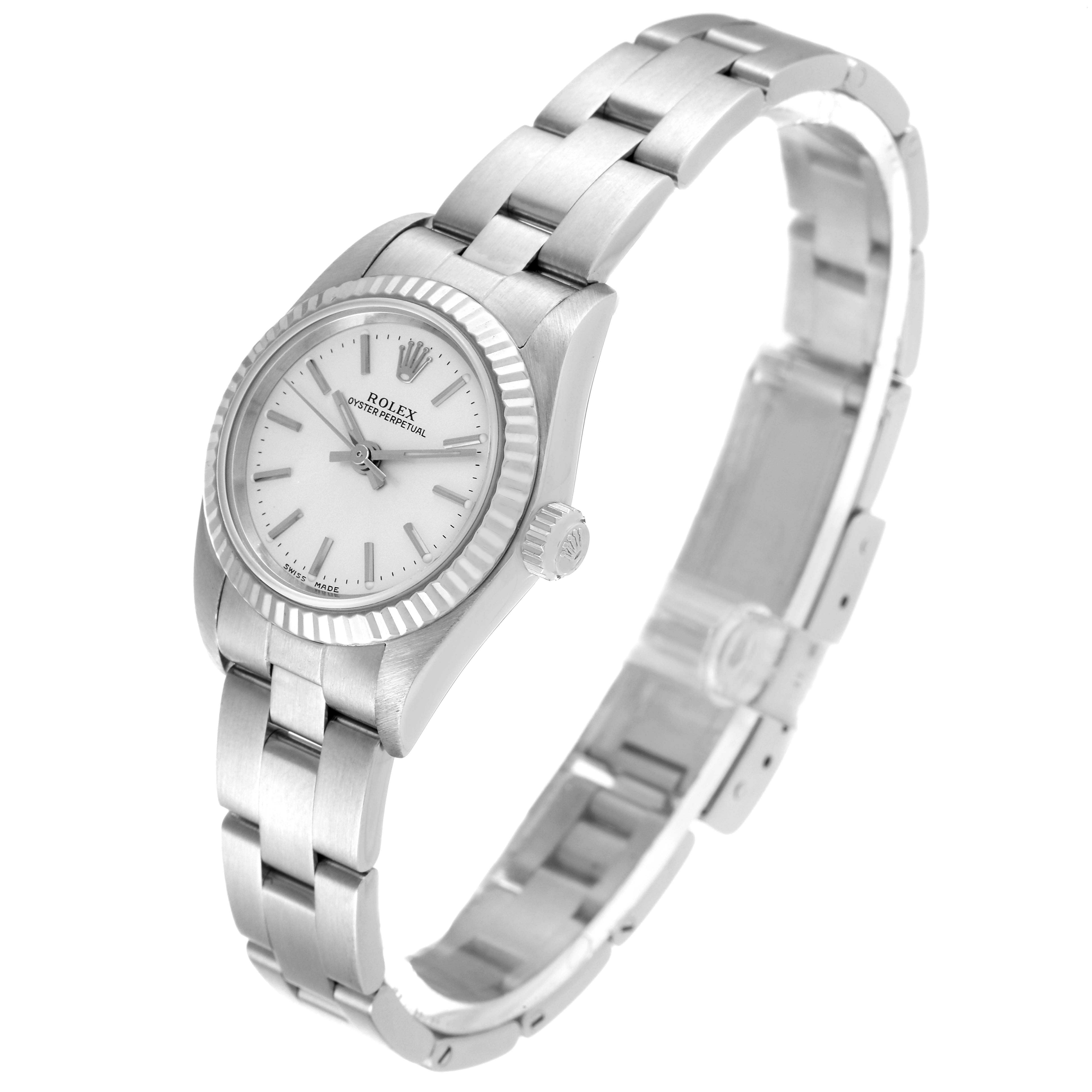 The Rolex Oyster Perpetual 76094 Women
s Stainless Steel Silver Dial 76094 Women
s Stainless Steel Silver Dial watch is shown at an angle highlighting its face, case, crown, and part of the bracelet.