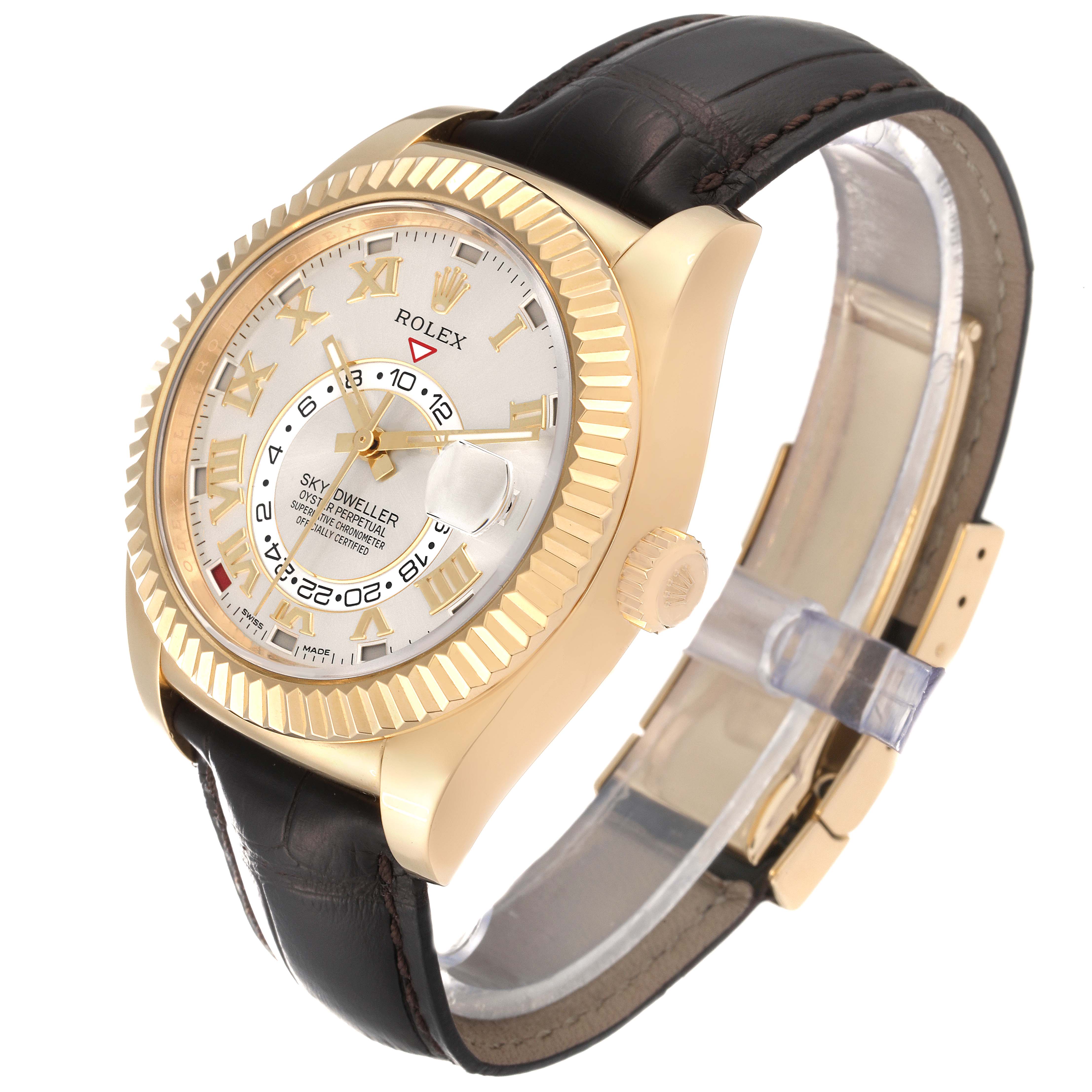 The Rolex Sky-Dweller 326138 Men's Yellow Gold Silver Dial 326138 Men's Yellow Gold Silver Dial watch is shown at an angled front view, displaying its gold case, dial, and brown leather strap.
