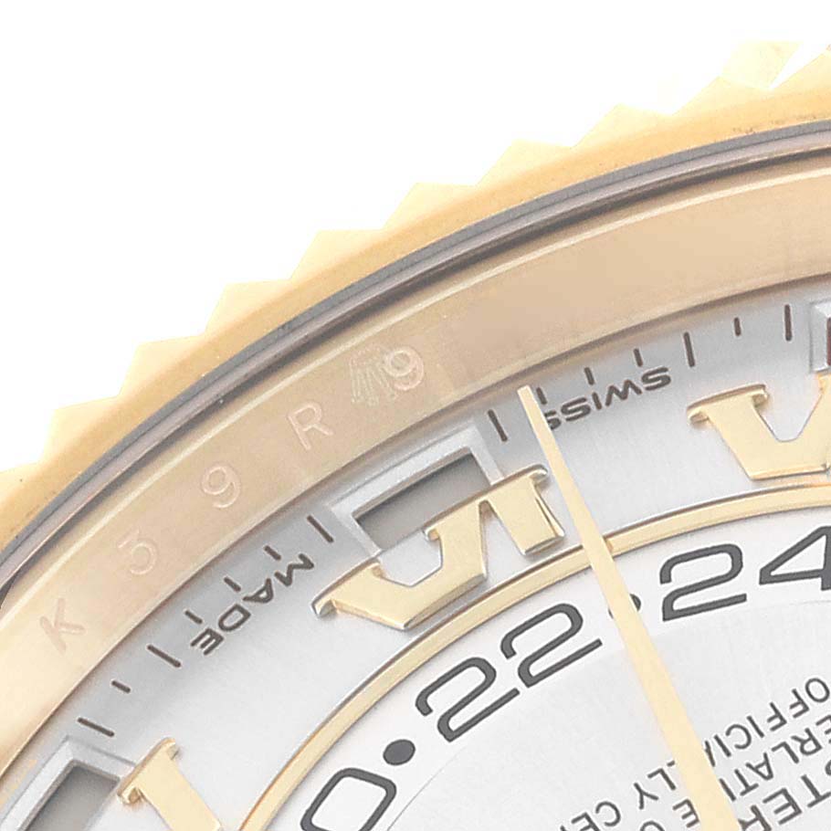 This close-up image shows the top right section of the dial and bezel of a Rolex Sky-Dweller 326138 Men's Yellow Gold Silver Dial 326138 Men's Yellow Gold Silver Dial watch.