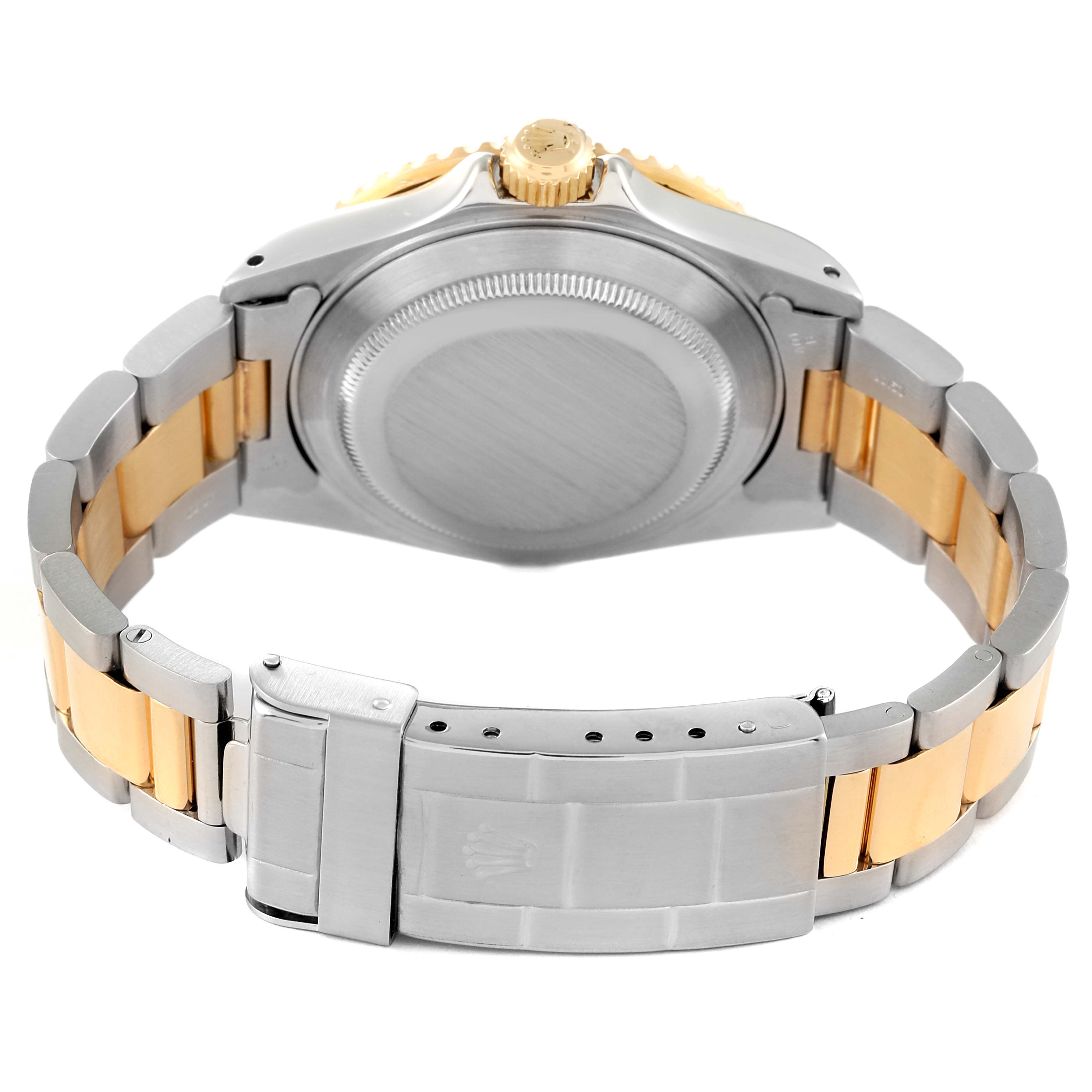 The image shows the back view of a Rolex Submariner 16613 Men's Steel and Gold (two tone) Blue Dial 16613 Men's Steel and Gold (two tone) Blue Dial watch, highlighting the case back, bracelet, and clasp.