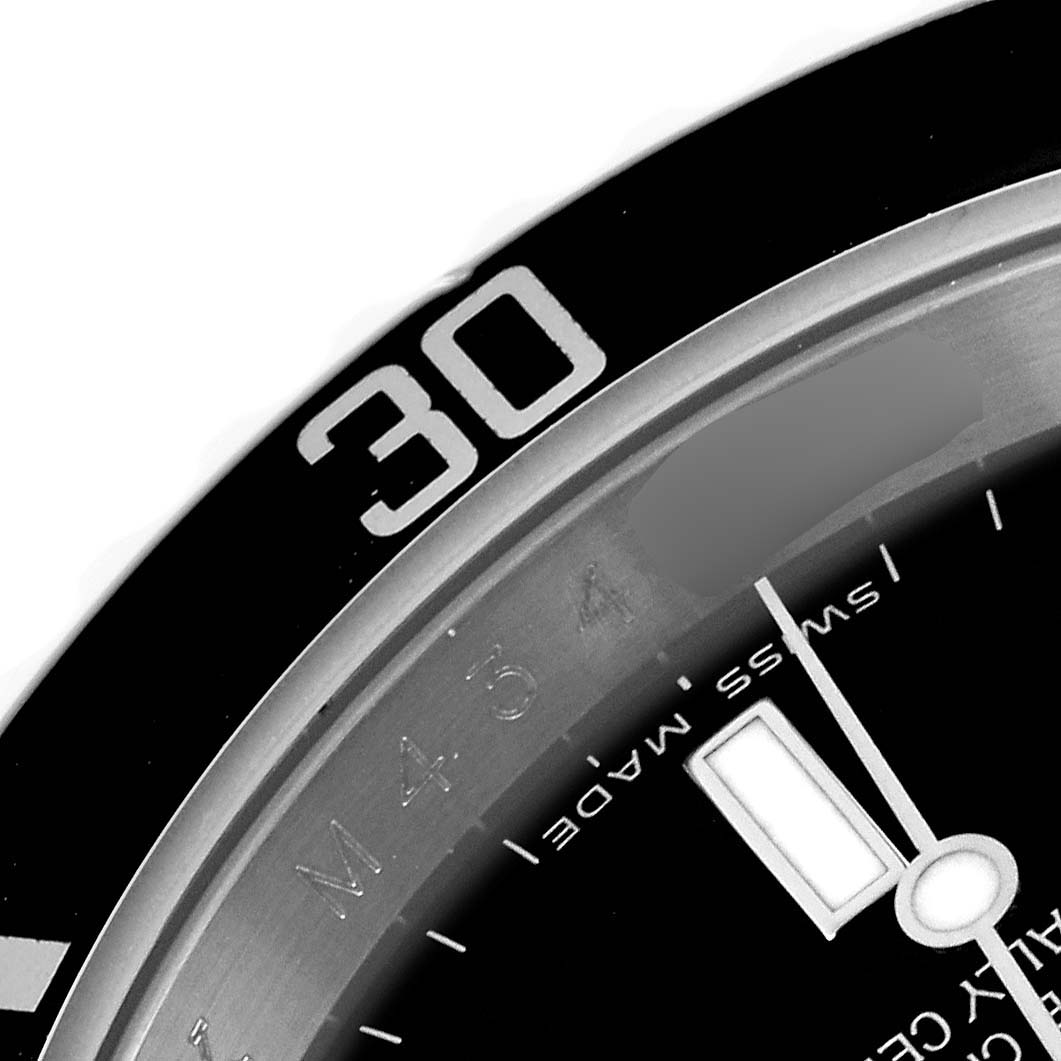The image shows a close-up of the bezel and part of the dial of a Rolex Submariner 16610 Men's Stainless Steel Black Dial 16610 Men's Stainless Steel Black Dial watch, highlighting the 30-minute marker.