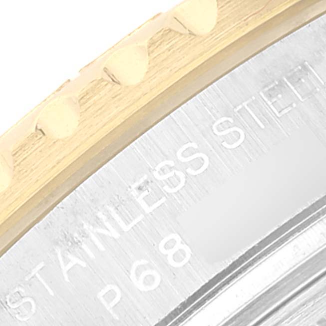 The image shows a close-up of the bezel and part of the case back of a Rolex Yacht-Master 169623 Women's Steel and Gold (two tone) White Dial 169623 Women's Steel and Gold (two tone) White Dial watch, highlighting the "STAINLESS STEEL" engraving.