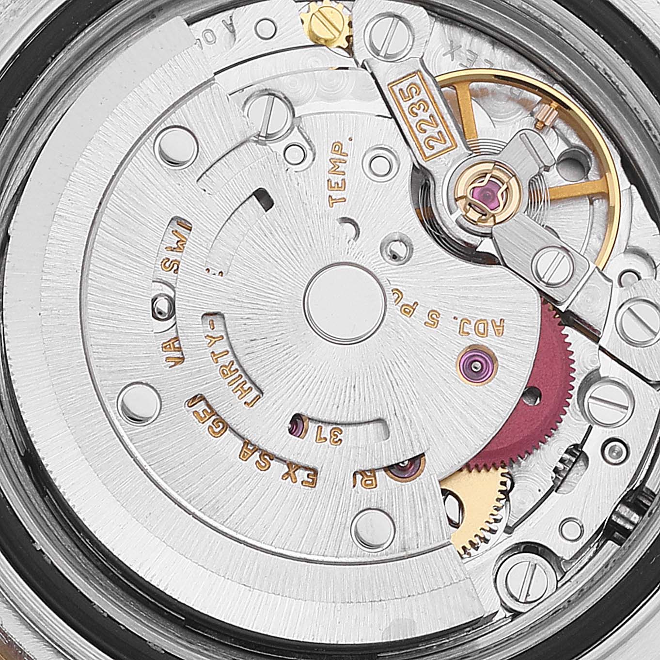 This close-up image shows the inner mechanism of the Rolex Yacht-Master 169623 Women's Steel and Gold (two tone) White Dial 169623 Women's Steel and Gold (two tone) White Dial watch, highlighting the movement and intricate parts.