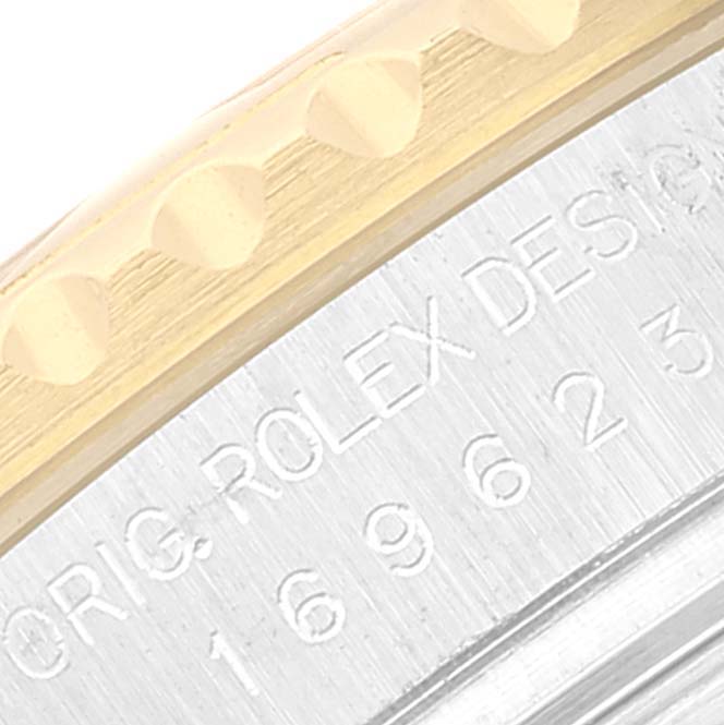 This close-up image shows the side edge of the bezel and the engraved side case of the Rolex Yacht-Master 169623 Women's Steel and Gold (two tone) White Dial 169623 Women's Steel and Gold (two tone) White Dial watch.