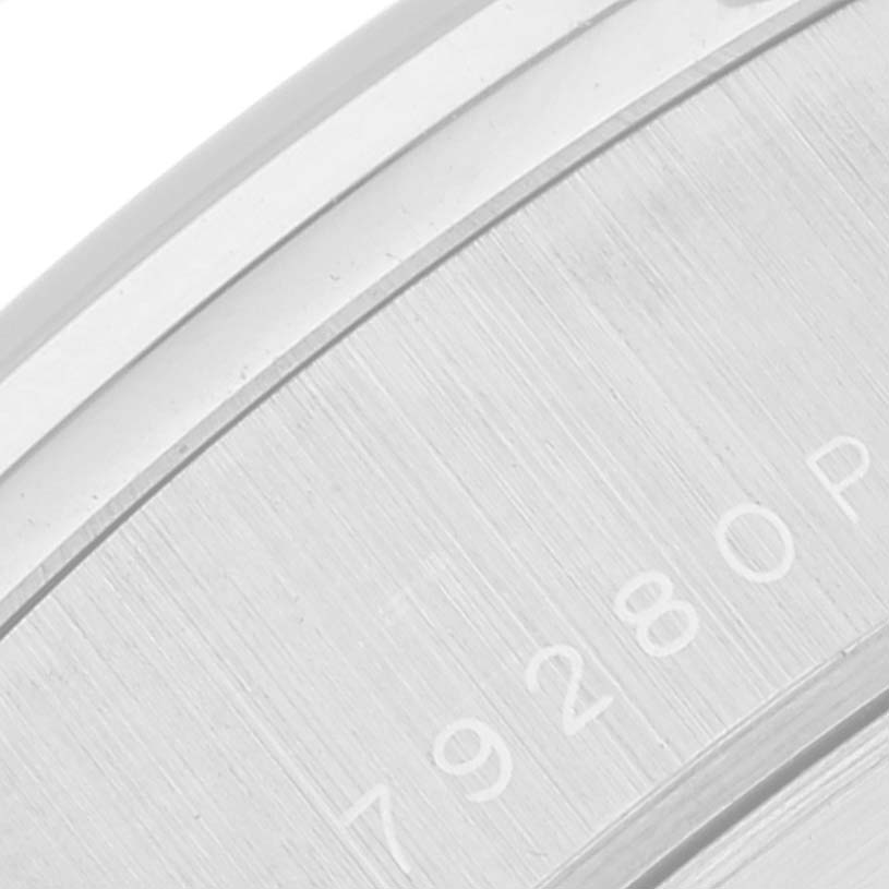 This image shows a close-up of the case back of the Tudor Tiger 79280 Men's Stainless Steel Blue Dial 79280 Men's Stainless Steel Blue Dial watch, focusing on the engraved text section.