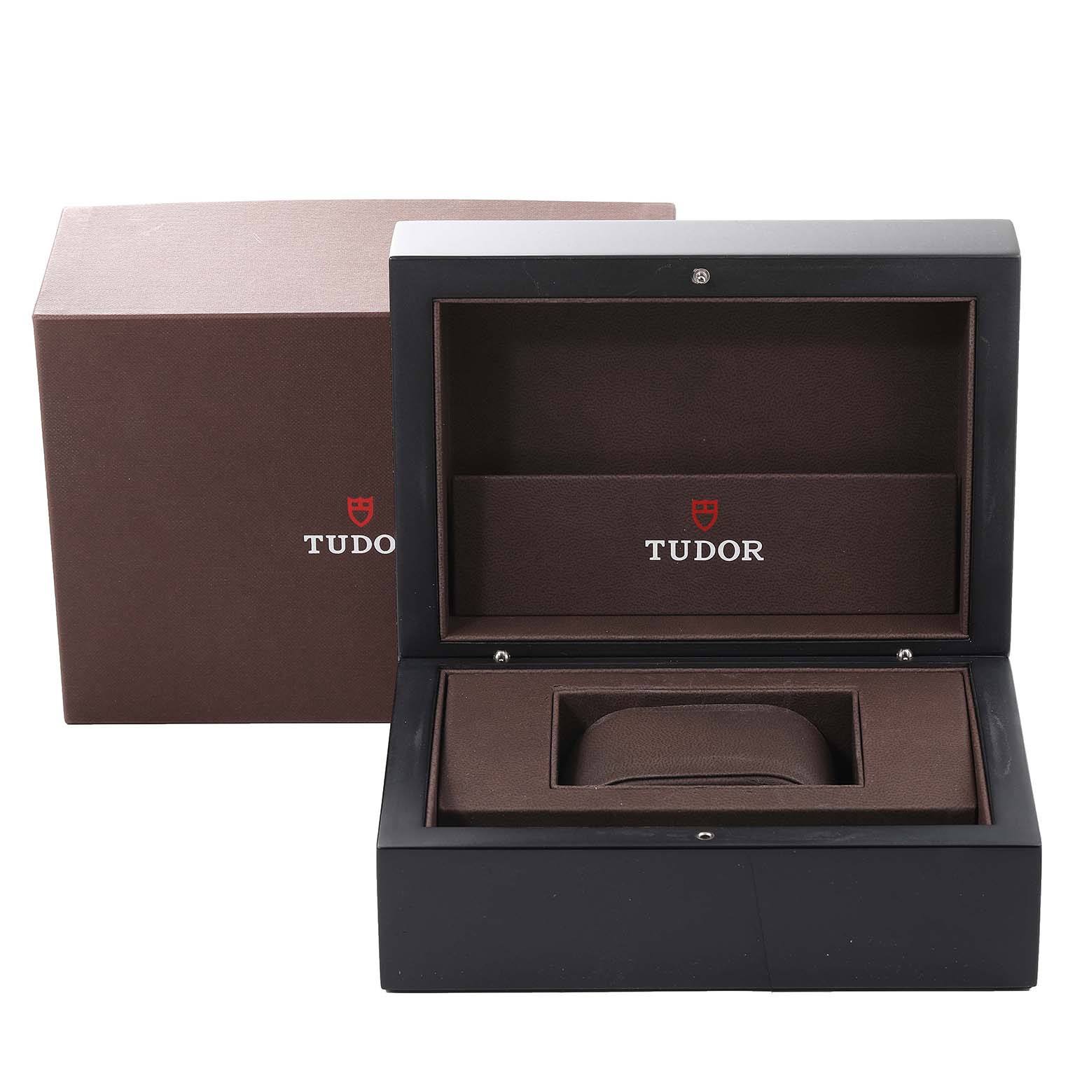 The image shows an open and empty Tudor watch box for the Tiger model, with a visible inner cushion and outer packaging.