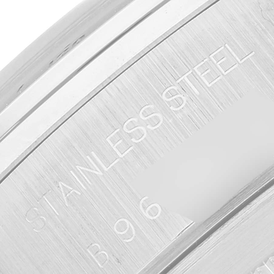 This image shows a close-up view of the case back of the Tudor Tiger 79280 Men's Stainless Steel Blue Dial 79280 Men's Stainless Steel Blue Dial watch, featuring "STAINLESS STEEL" engraving.