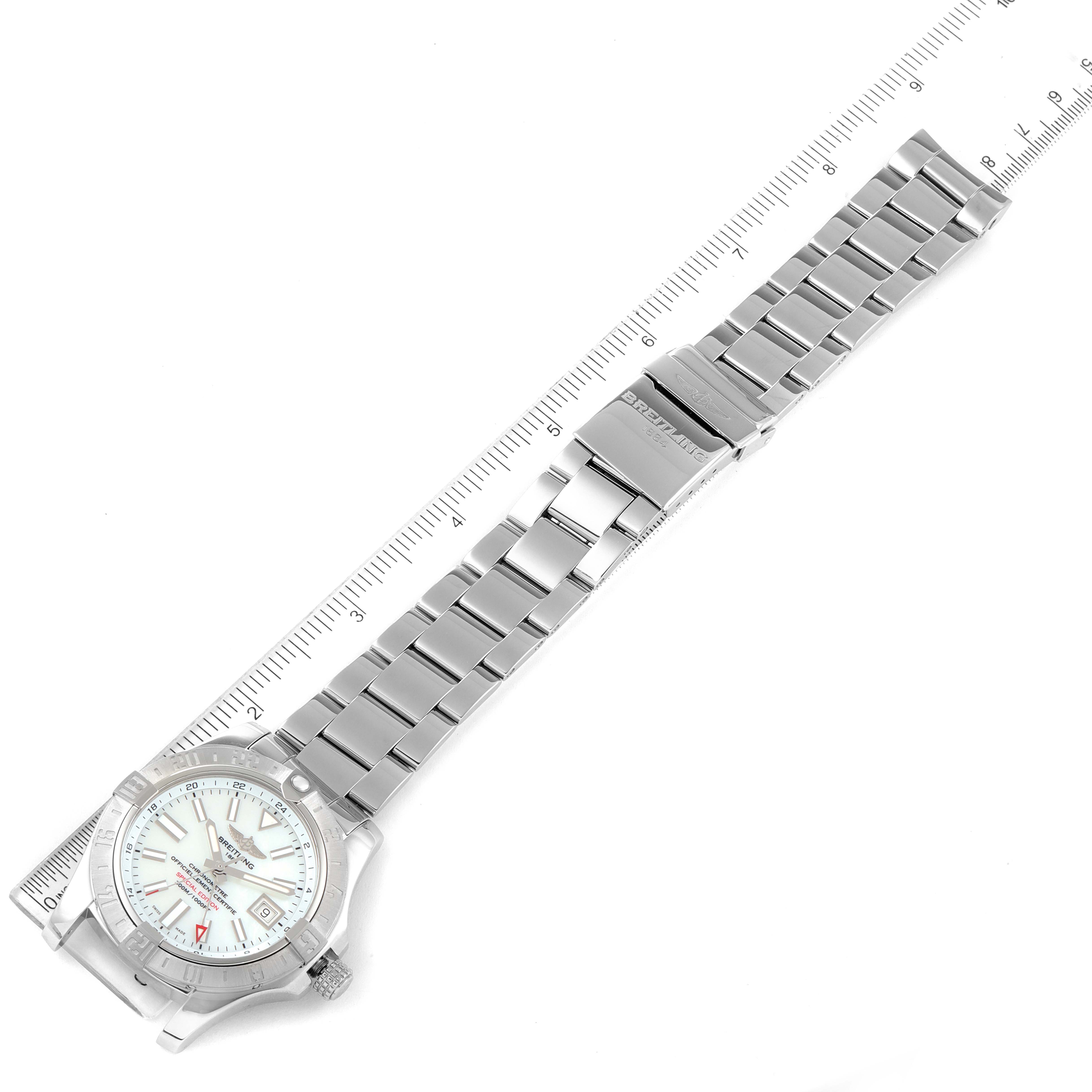 The image shows a top-down view of the Breitling Avenger A3239011-C872-170A Men's Stainless Steel Mother of Pearl Dial A3239011-C872-170A Men's Stainless Steel Mother of Pearl Dial watch, displaying the face, bezel, and metal bracelet alongside a ruler.