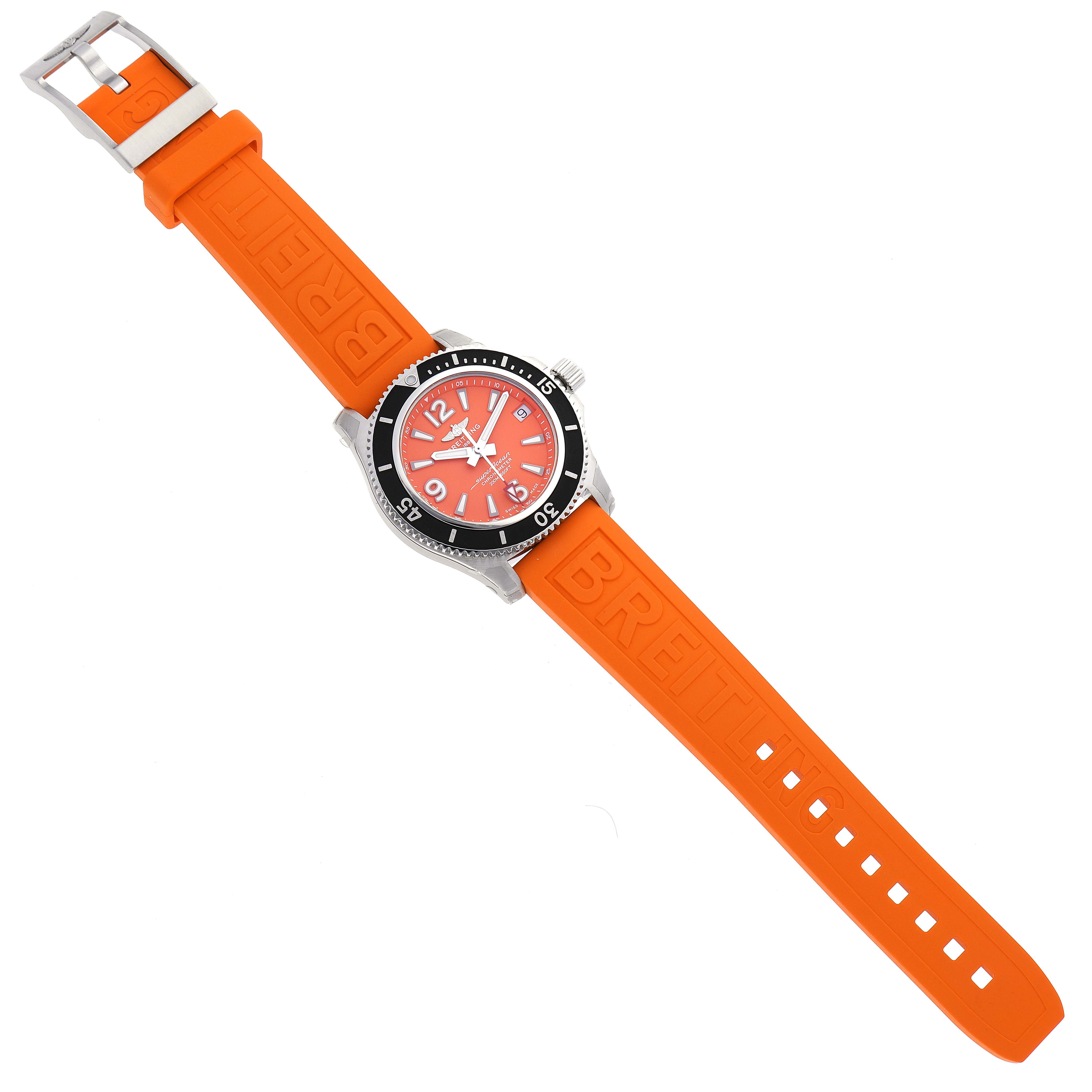 The image shows a top view of the Breitling A17316 Women's Stainless Steel Orange Dial A17316 Women's Stainless Steel Orange Dial Superocean 36mm Orange Dial Steel Ladies Watch A17316, showcasing its dial, strap, and buckle.