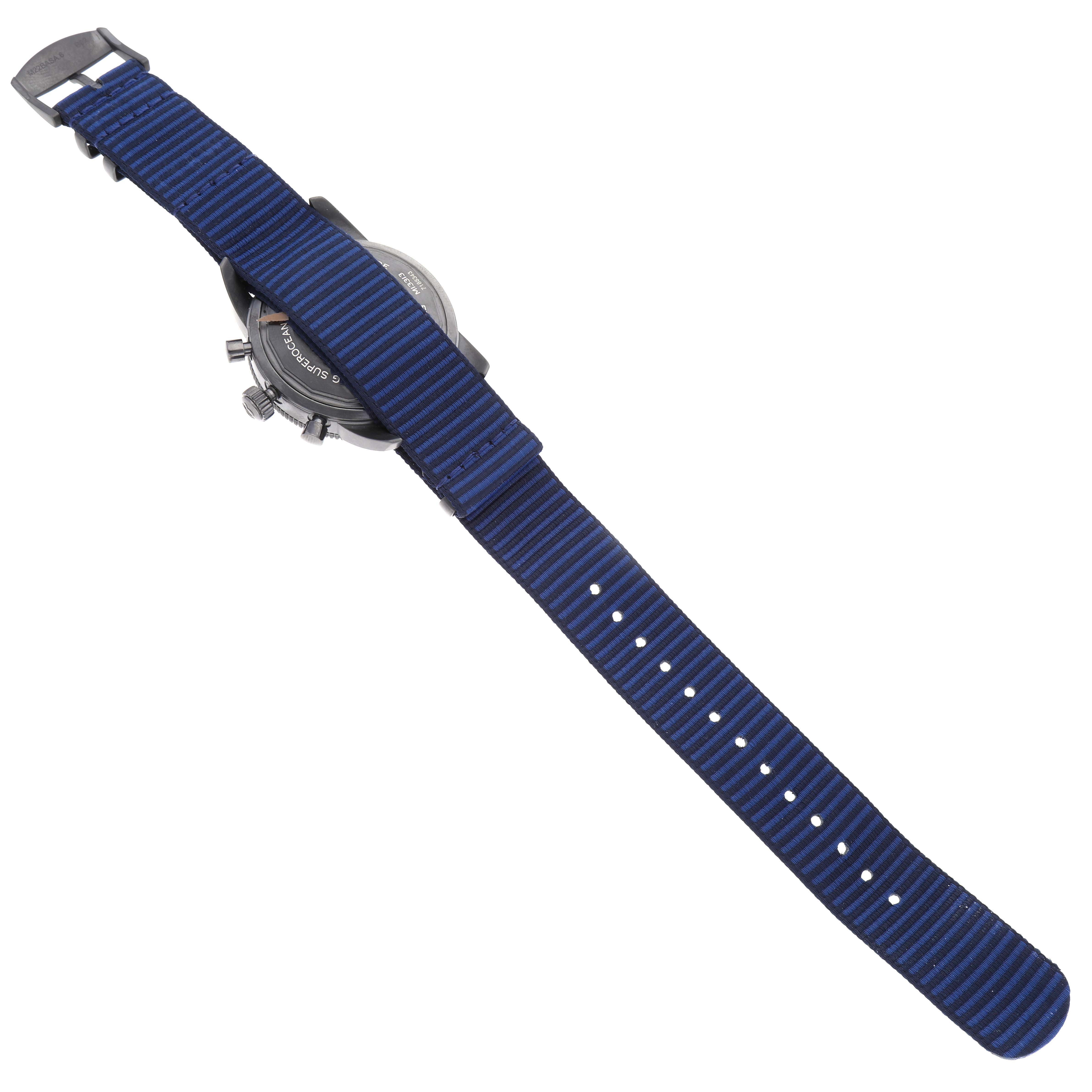 The image shows the back of a Breitling Superocean M13313 Men
s Stainless Steel Blue Dial M13313 Men
s Stainless Steel Blue Dial watch with a blue striped fabric strap.