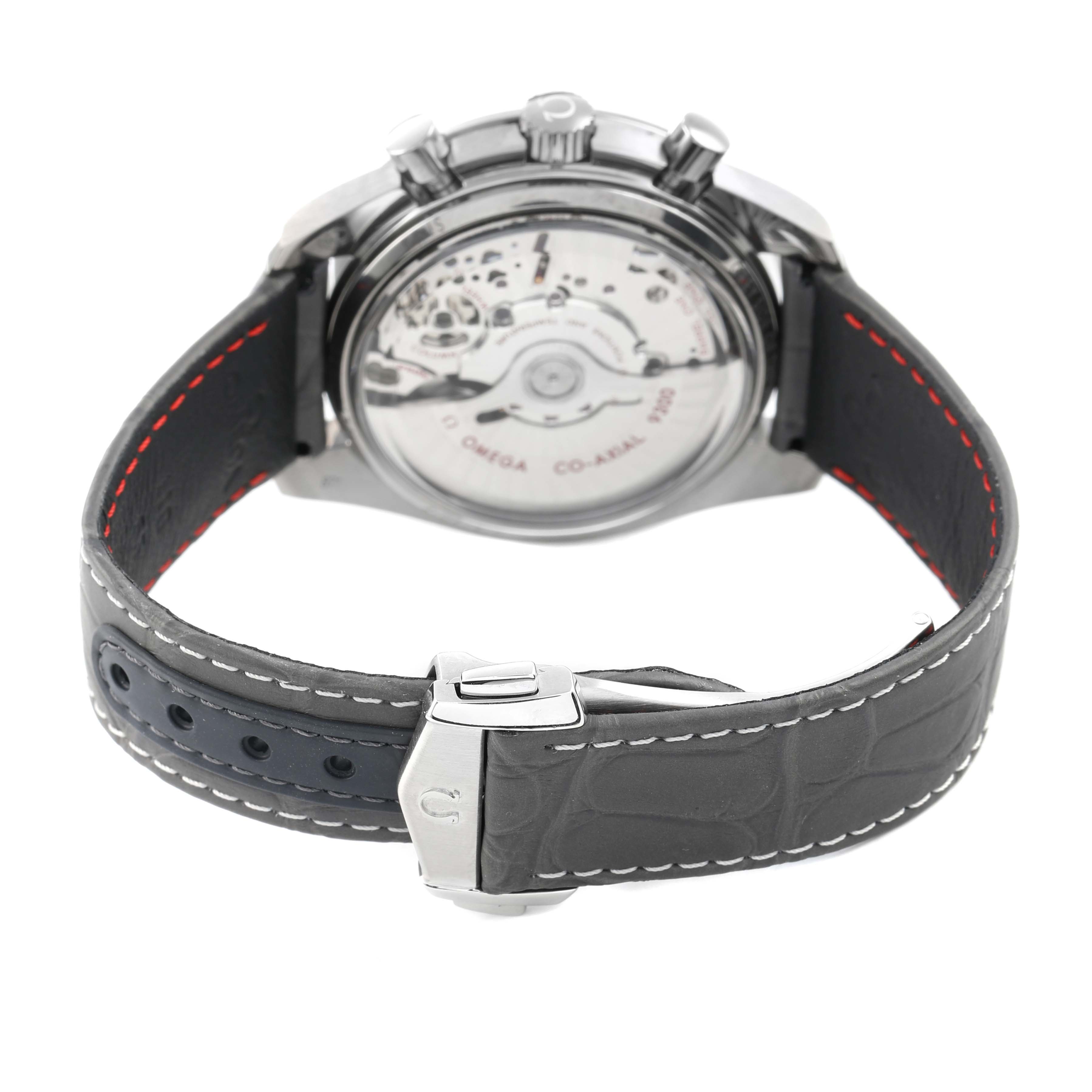 The image shows the back of an Omega Speedmaster 311.93.44.51.99.002 Men's Ceramic Grey Dial watch, highlighting the transparent case back and leather strap with clasp.