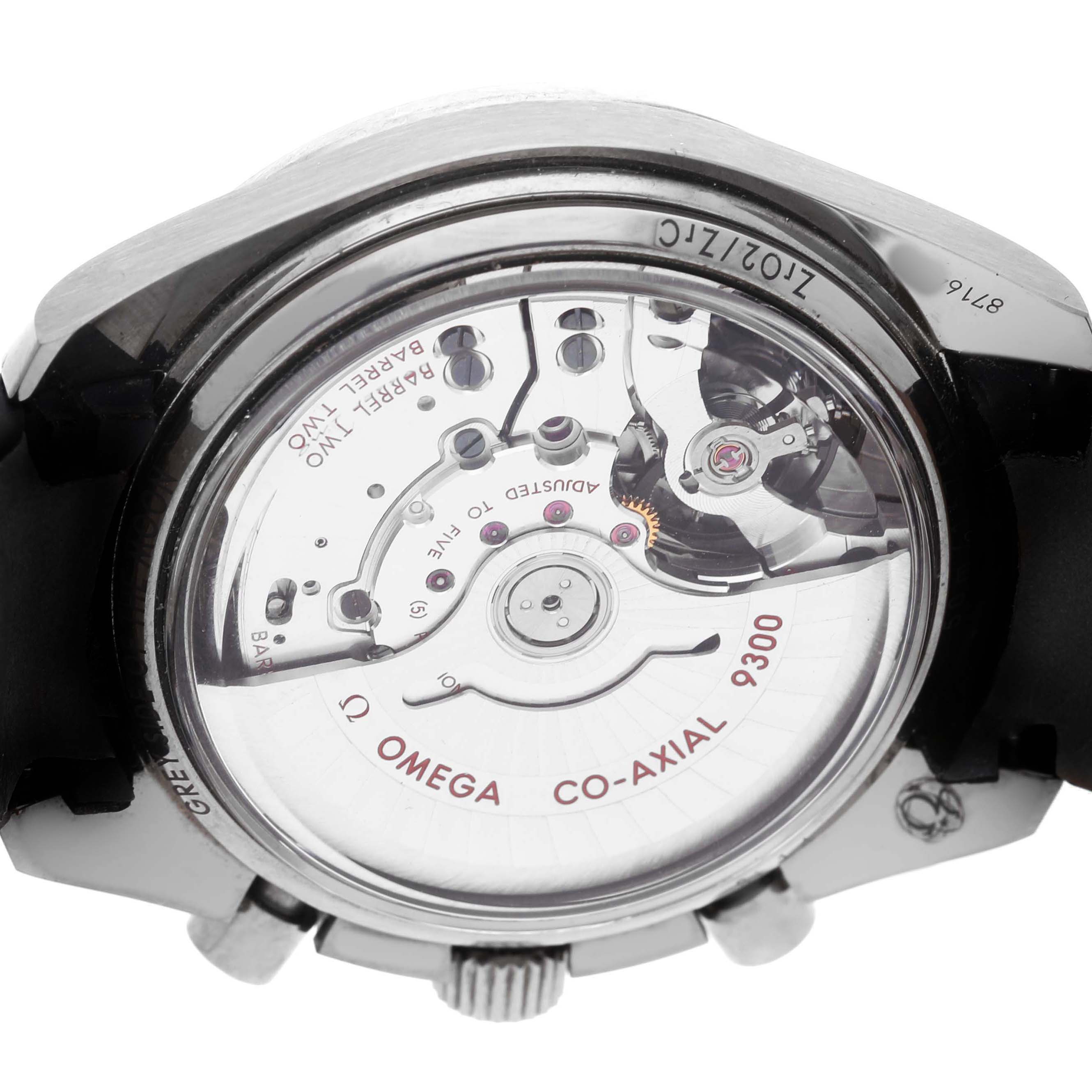 The image shows the back of an Omega Speedmaster 311.93.44.51.99.002 Men's Ceramic Grey Dial, revealing its Co-Axial 9300 movement through a transparent case back.