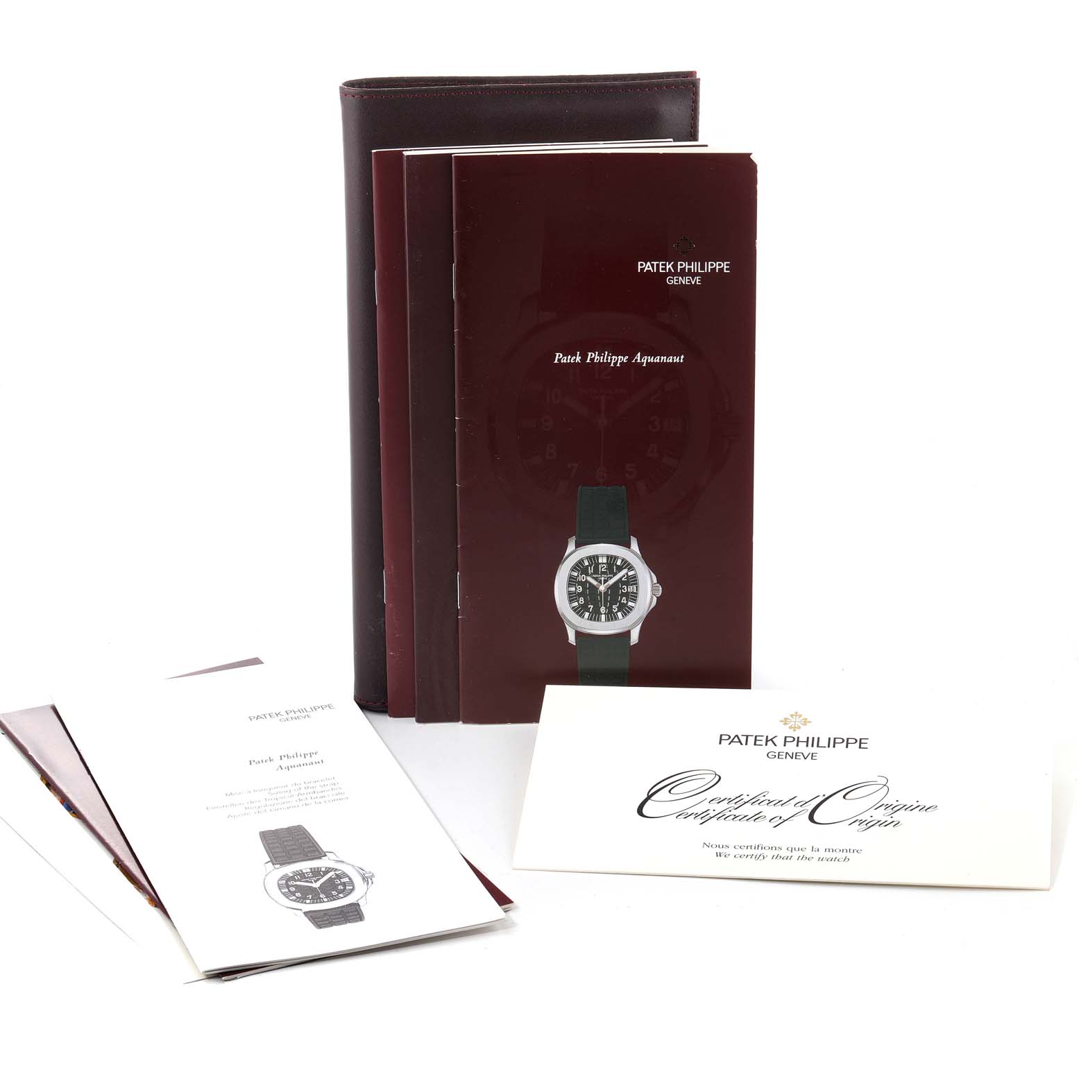 The image shows Patek Philippe Aquanaut 5064A-001 Men's Stainless Steel Black Dial 5064A-001 Men's Stainless Steel Black Dial model watch booklets and a certificate from a straight-on angle.