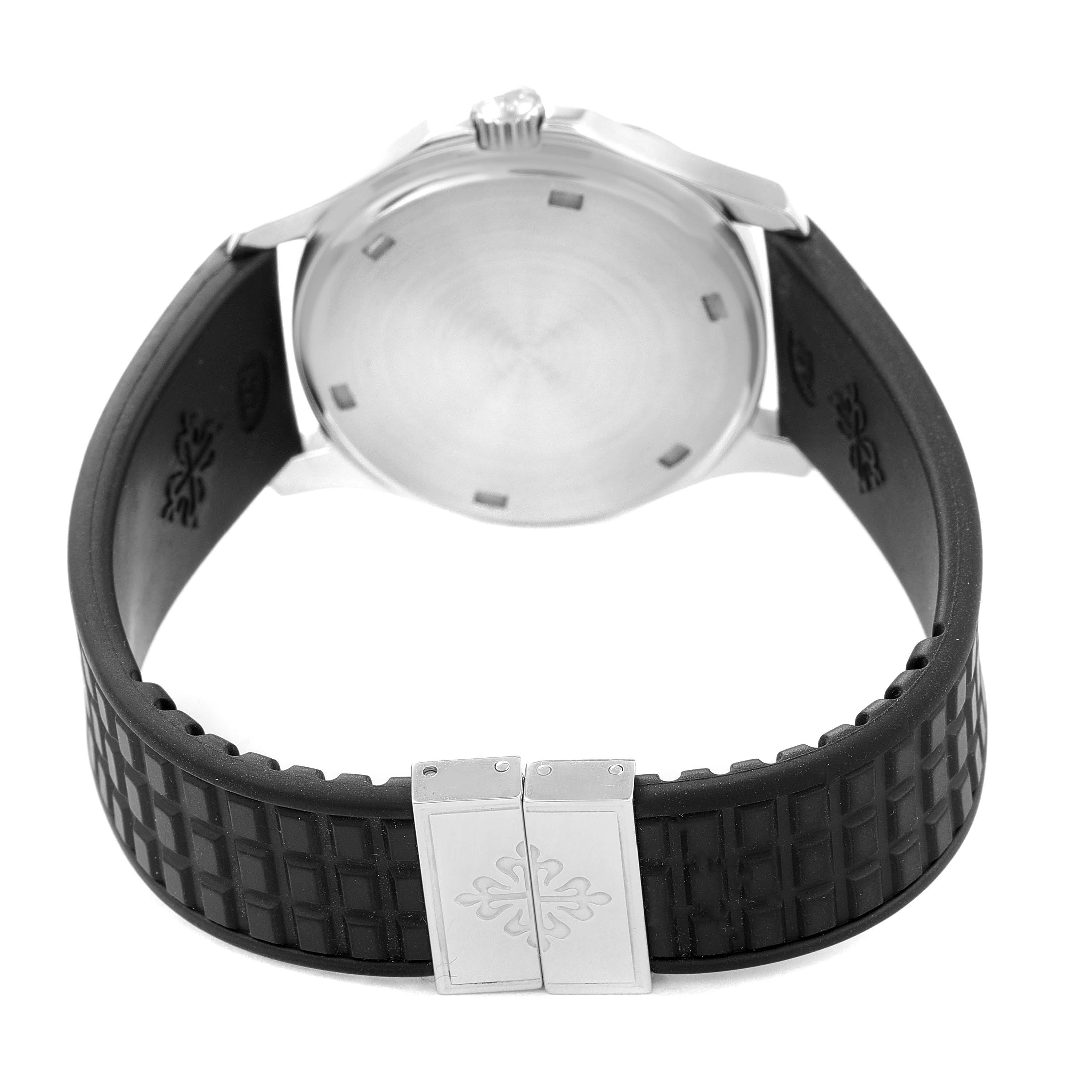 The image shows the back of a Patek Philippe Aquanaut 5064A-001 Men's Stainless Steel Black Dial 5064A-001 Men's Stainless Steel Black Dial watch, focusing on the case back, crown, and rubber strap with a signed clasp.