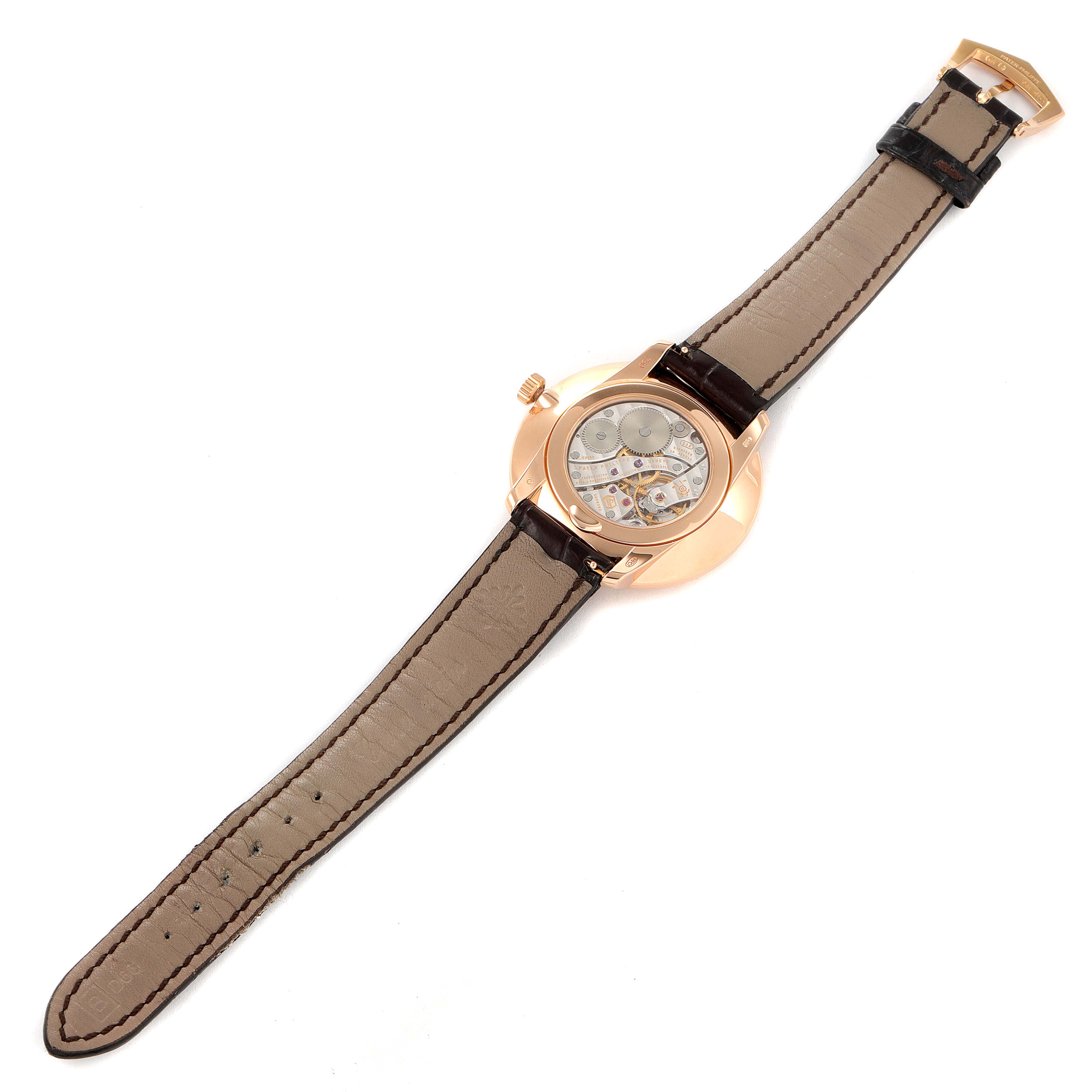The image shows the back of a Patek Philippe Calatrava 5123R-001 Men's Rose Gold Silver Dial 5123R-001 Men's Rose Gold Silver Dial watch, highlighting its open case back and leather strap.