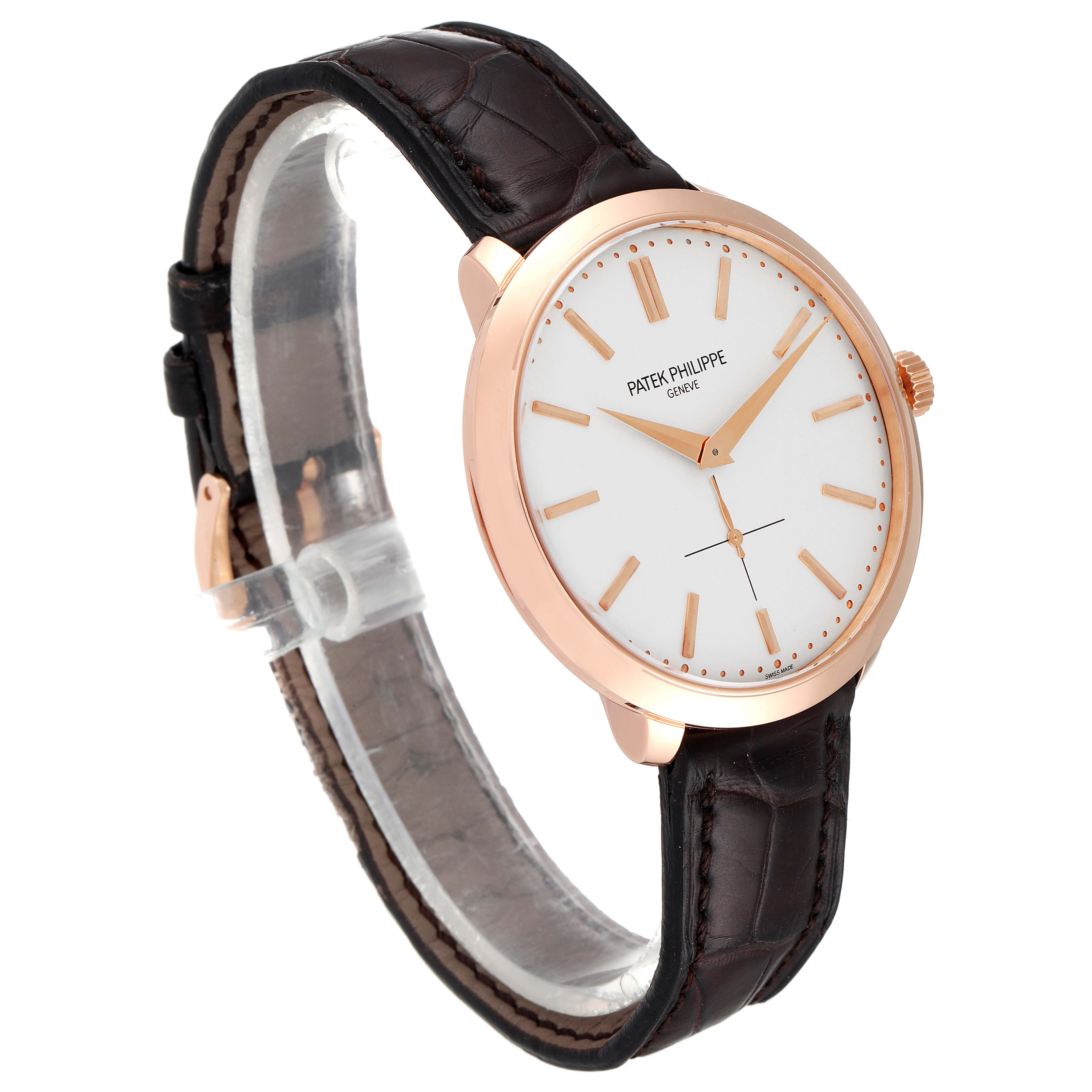 The image shows a side angle of a Patek Philippe Calatrava 5123R-001 Men's Rose Gold Silver Dial 5123R-001 Men's Rose Gold Silver Dial watch featuring its face, crown, and leather strap.