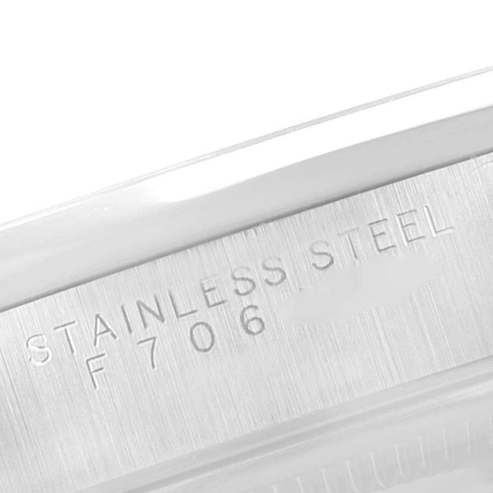 This image shows an up-close view of the side of a Rolex Air-King 14000 Men's Stainless Steel Blue Dial 14000 Men's Stainless Steel Blue Dial watch, highlighting the stainless steel material engraving.