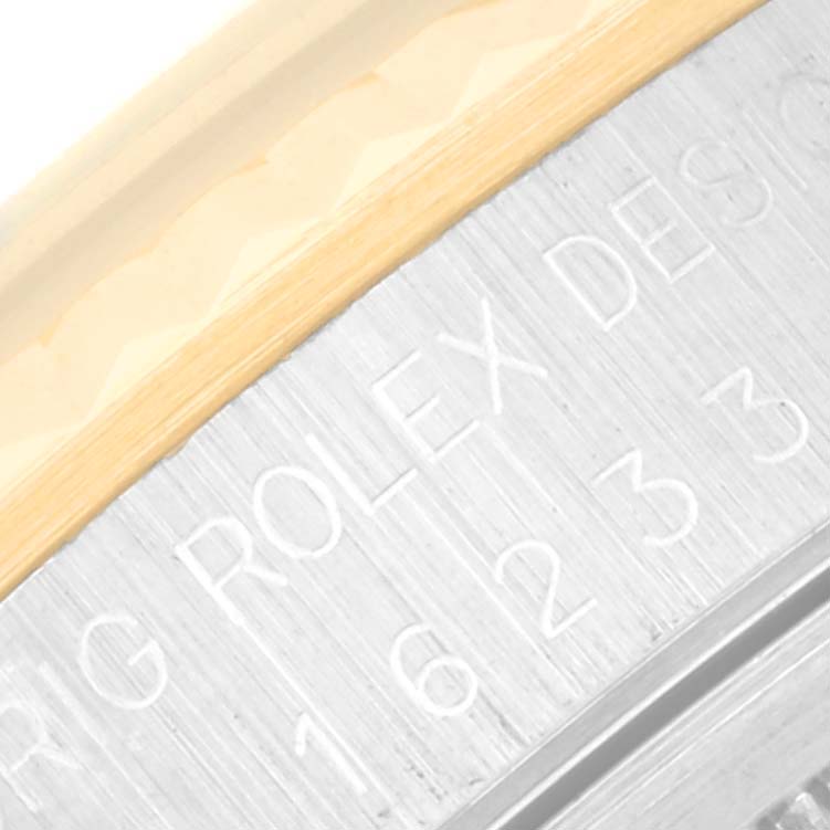 This close-up image shows the side of the Rolex Datejust 16233 Men's Steel and Gold (two tone) Blue Dial 16233 Men's Steel and Gold (two tone) Blue Dial model, focusing on the engraved details and metal structure.