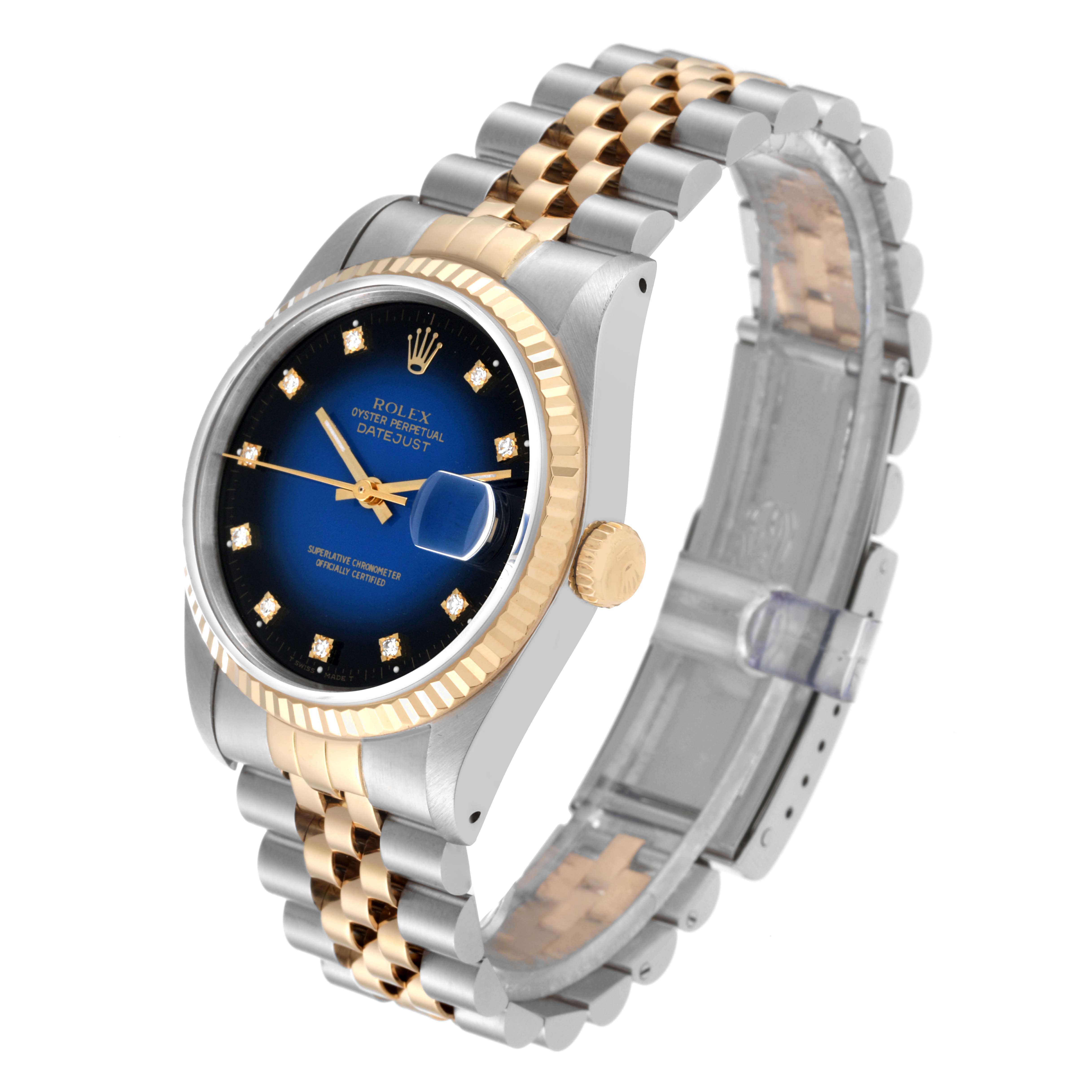 This image shows a Rolex Datejust 16233 Men's Steel and Gold (two tone) Blue Dial 16233 Men's Steel and Gold (two tone) Blue Dial watch, angled to display its bezel, dial, crown, and two-tone bracelet.