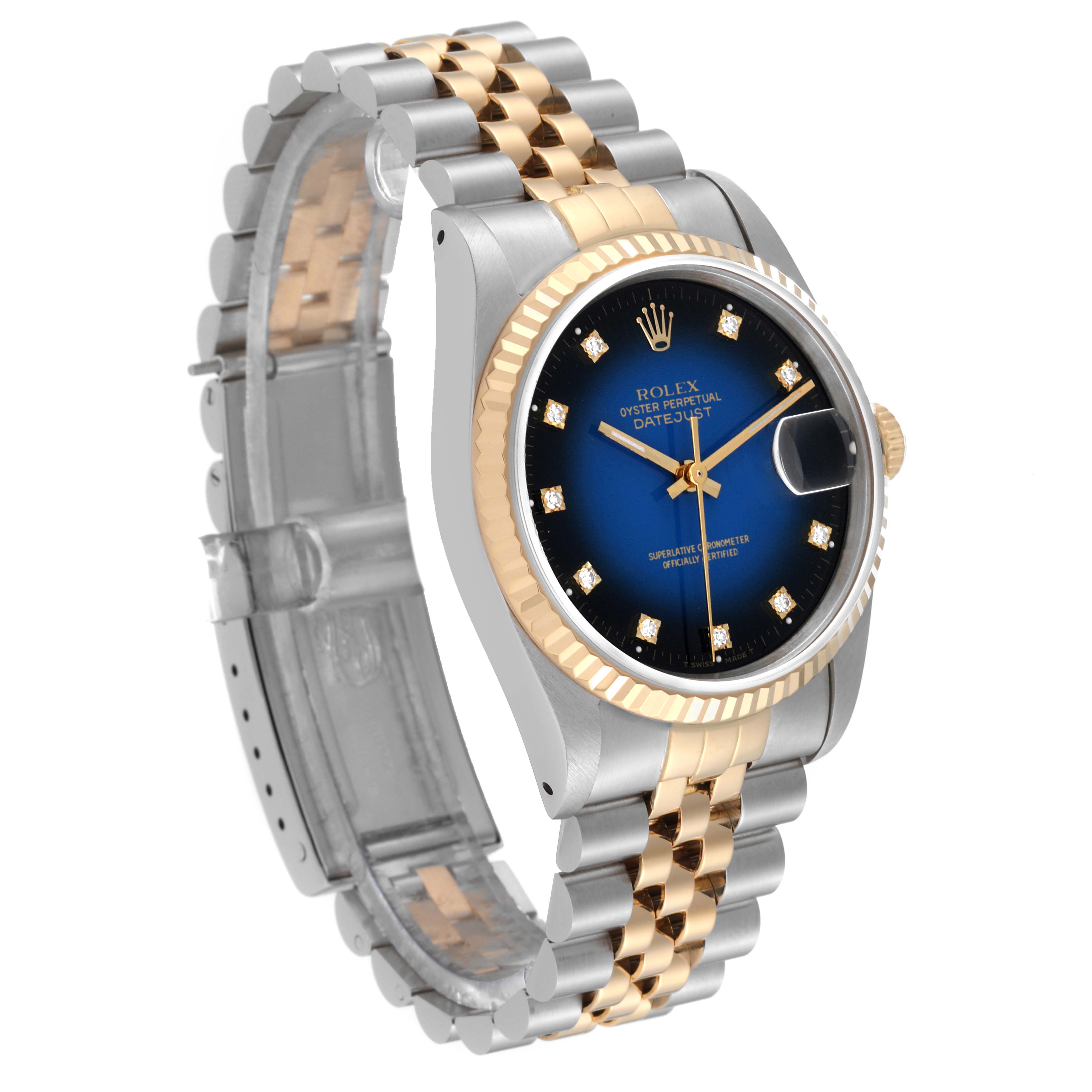 The Rolex Datejust 16233 Men's Steel and Gold (two tone) Blue Dial 16233 Men's Steel and Gold (two tone) Blue Dial watch is shown at a three-quarter angle, highlighting its face, bezel, and two-tone bracelet.
