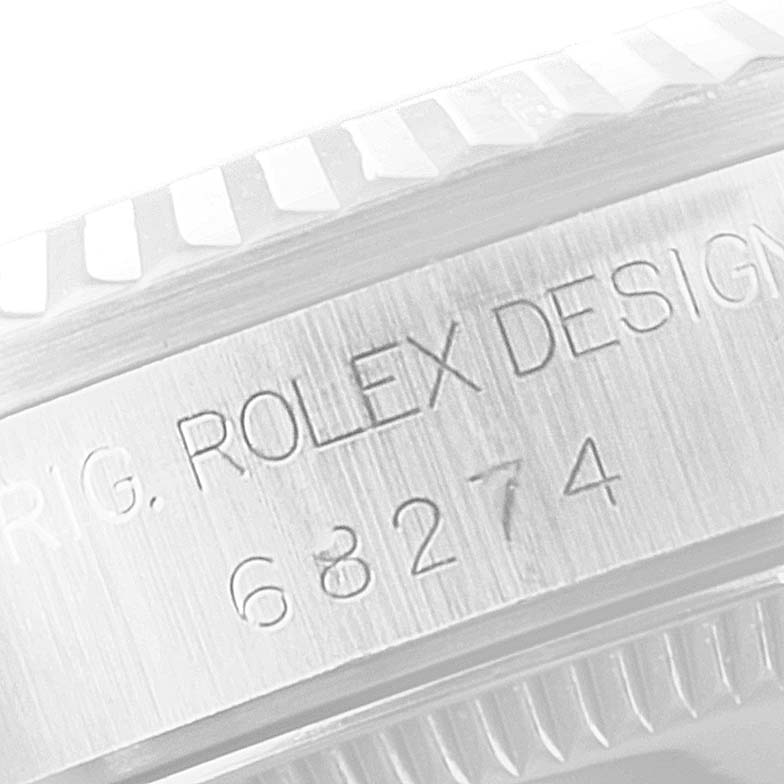 The image shows the side engraving and part of the bezel of a Rolex Mid-Size 68274 Women's Stainless Steel Silver Dial 68274 Women's Stainless Steel Silver Dial model, including the model number 68274.