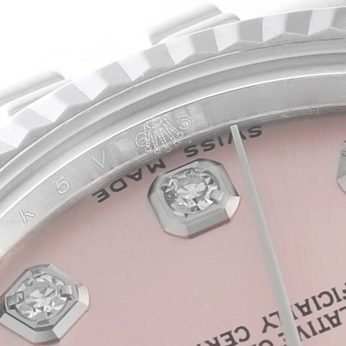 The image shows a close-up of the dial, diamond markers, and part of the bezel of a Mid-Size Rolex watch.