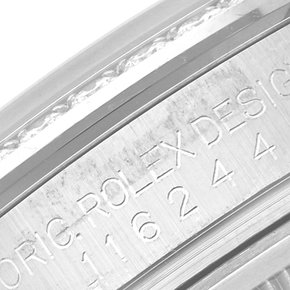 The image shows a close-up of the engraved bezel and inner rim of a Rolex Datejust 116244 Men's Stainless Steel Mother of Pearl Dial 116244 Men's Stainless Steel Mother of Pearl Dial watch.