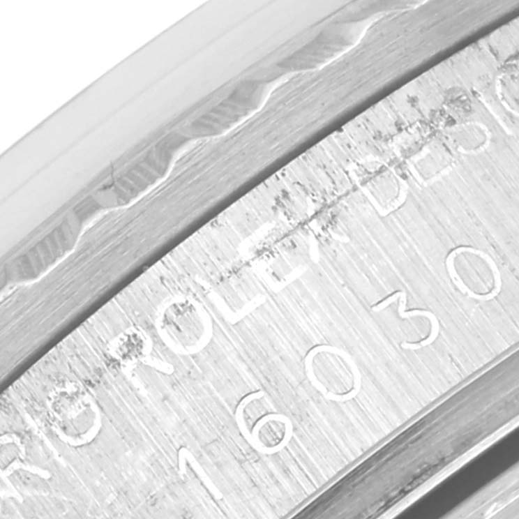 This close-up image shows the engraved bezel edge of the Vintage Collection model Rolex, displaying part of the model number "16030."