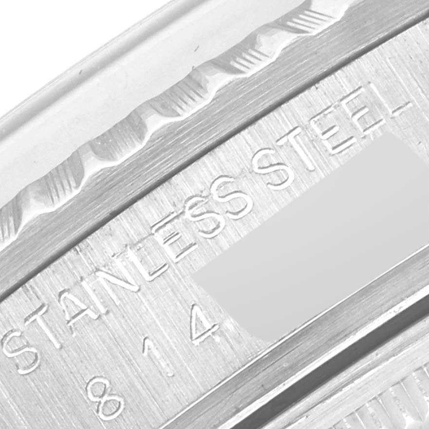 The image shows a close-up of the back of the Rolex Vintage Collection 16030 Men's Stainless Steel Silver Dial 16030 Men's Stainless Steel Silver Dial watch, focusing on the stainless steel engravings and serial number.