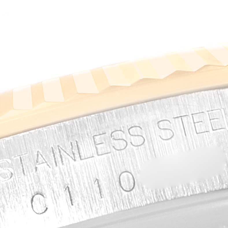 The image shows a close-up of the fluted bezel and part of the stainless steel case of a Rolex Datejust 16233 Men's Steel and Gold (two tone) White Dial 16233 Men's Steel and Gold (two tone) White Dial watch.