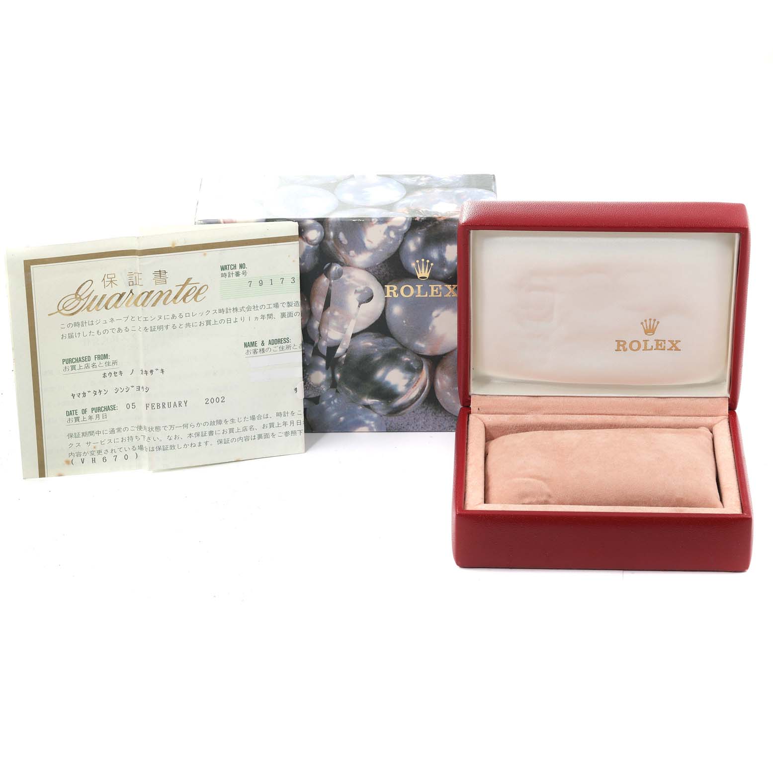 The image shows a Rolex Datejust 79173 Women's Steel and Gold (two tone) Champagne Dial 79173 Women's Steel and Gold (two tone) Champagne Dial watch box with packaging and a guarantee certificate set at an angle facing forward.