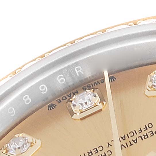 The image shows a close-up of the dial and bezel of a Rolex Datejust 279383RBR Women's Steel and Gold (two tone) Champagne Dial 279383RBR Women's Steel and Gold (two tone) Champagne Dial, displaying diamond hour markers and part of the serial number.
