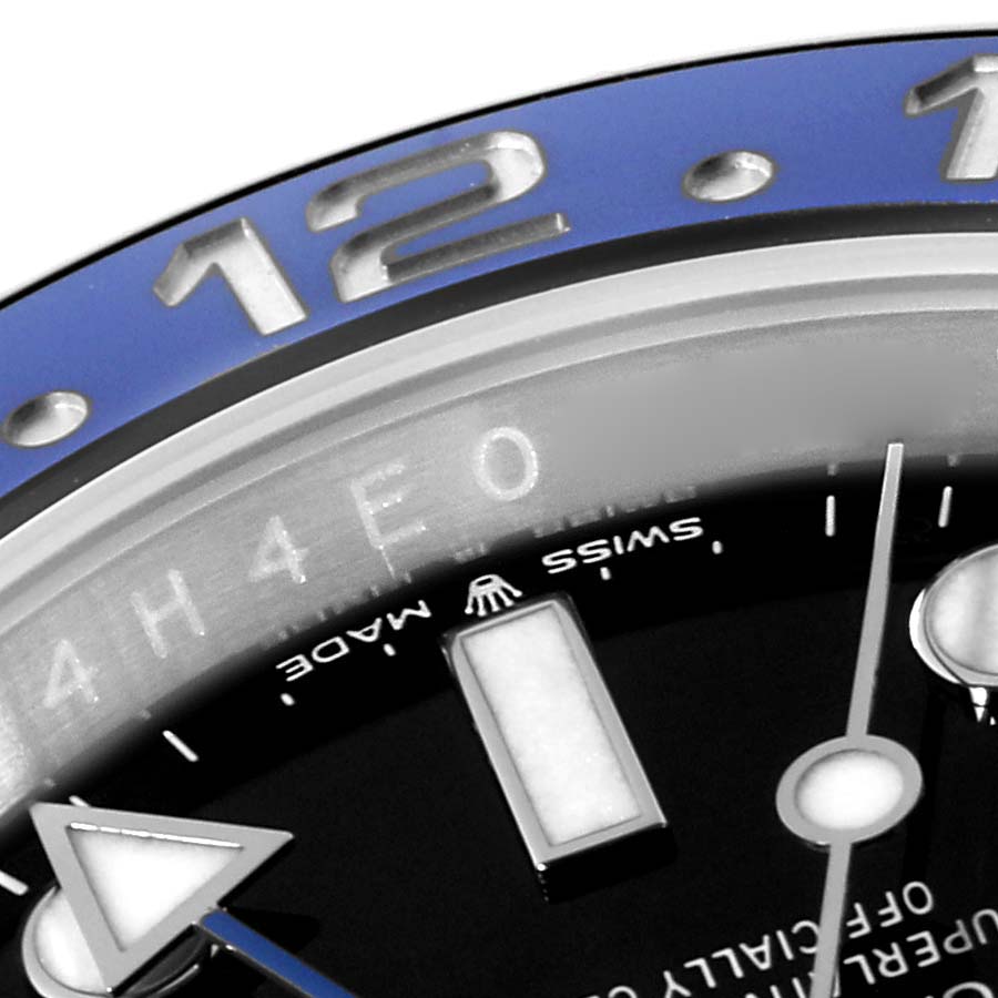 This close-up of the Rolex GMT-Master 126710BLNR Men
s Stainless Steel Black Dial 126710BLNR Men
s Stainless Steel Black Dial model showcases the bezel, part of the dial, and minute markers.
