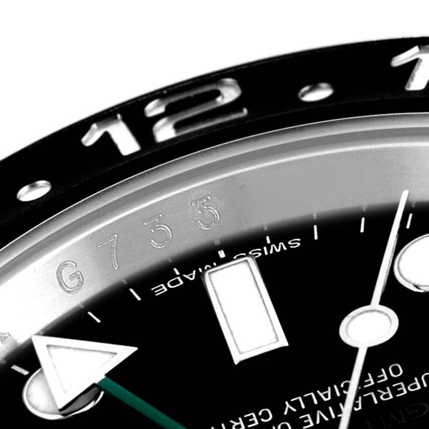 The image shows a close-up of the dial, hands, and part of the bezel of a Rolex GMT-Master 116710LN Men
s Stainless Steel Black Dial 116710LN Men
s Stainless Steel Black Dial watch.