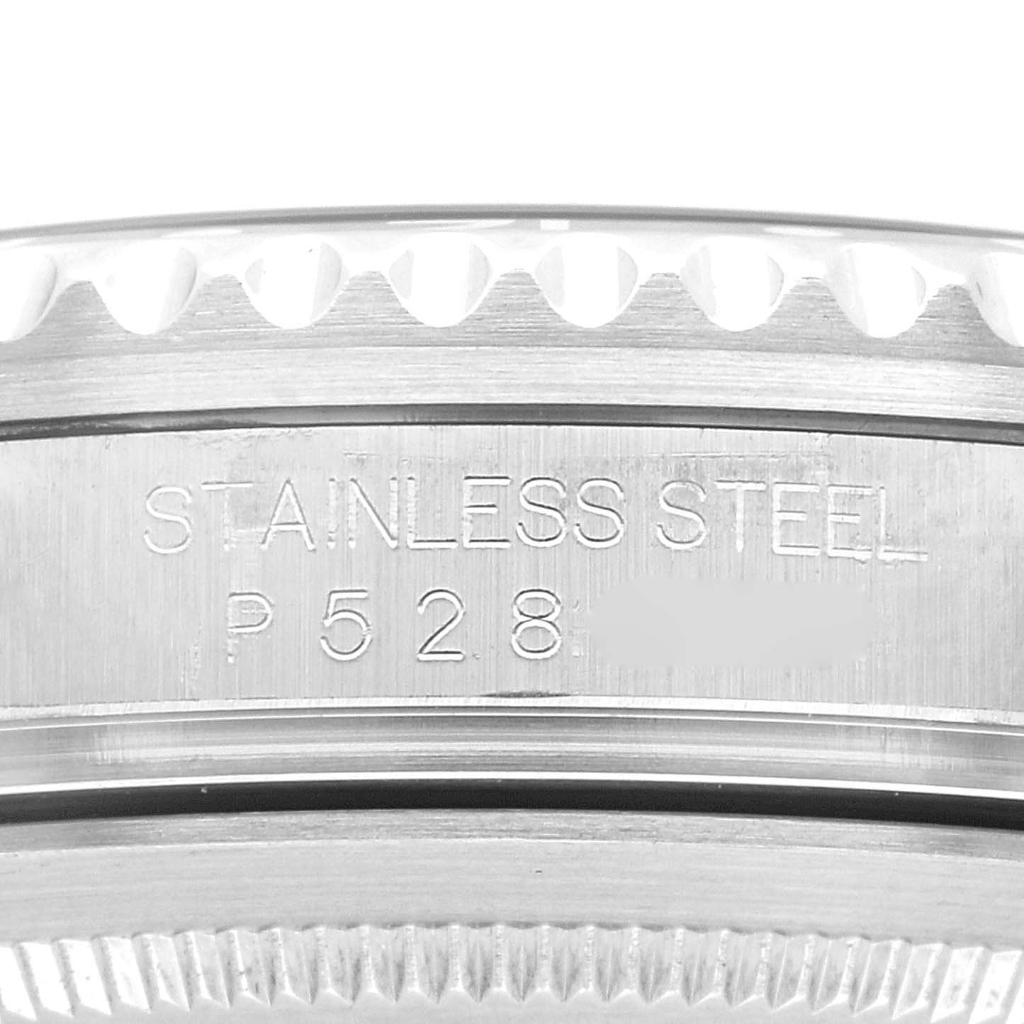 This image shows a close-up of the side of a Rolex GMT-Master 16710 Men's Stainless Steel Black Dial 16710 Men's Stainless Steel Black Dial watch, highlighting the "STAINLESS STEEL" engraving and a partial serial number.